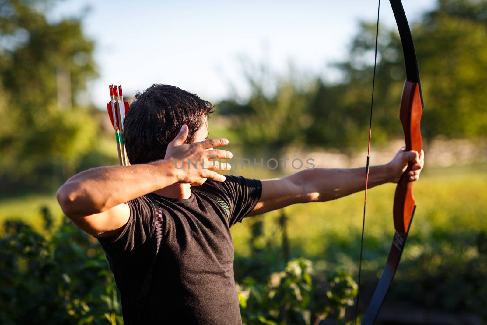 Young archer training with the  bow