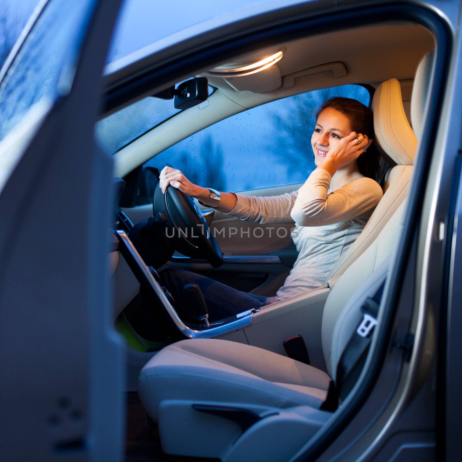 Pretty young woman driving her brand new car by viktor_cap