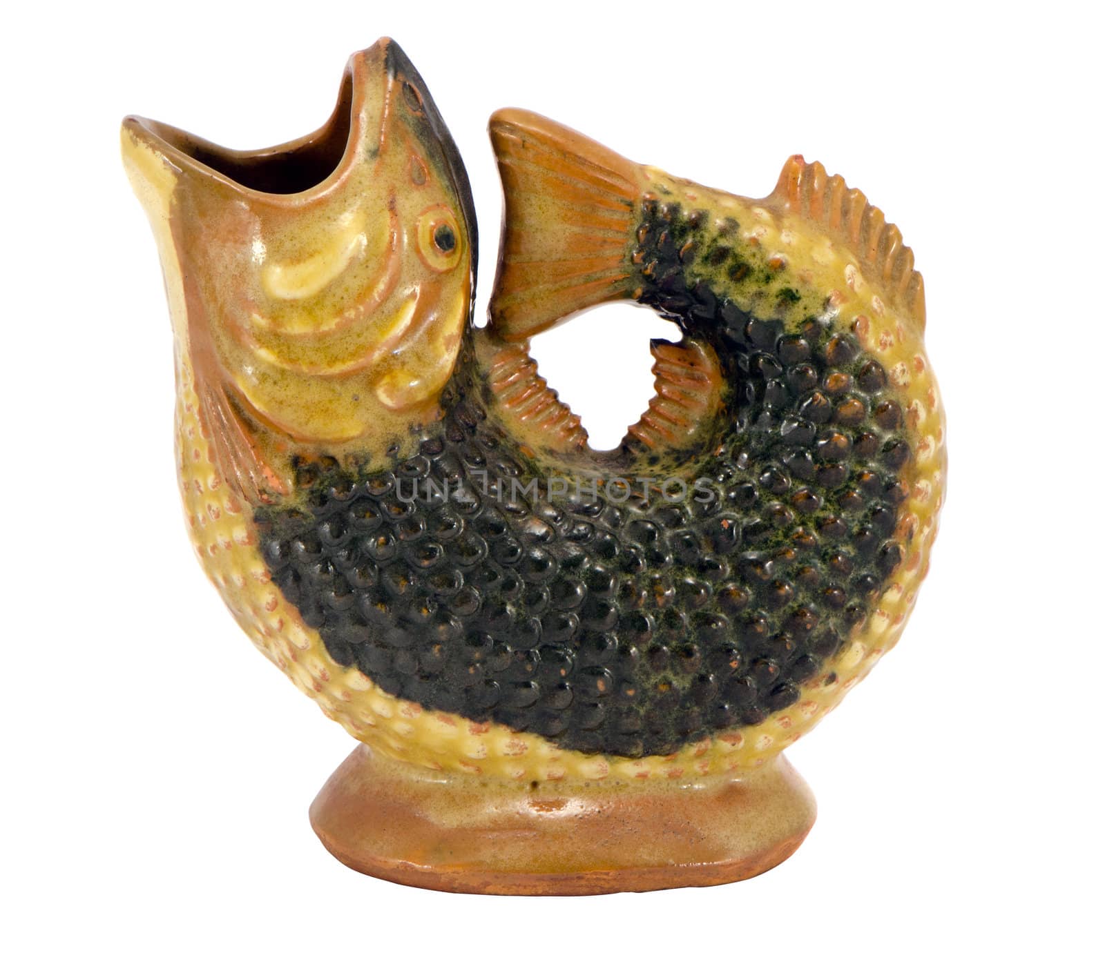 Fish figure sculpture made of clay isolated on white background. Homemade decoration.