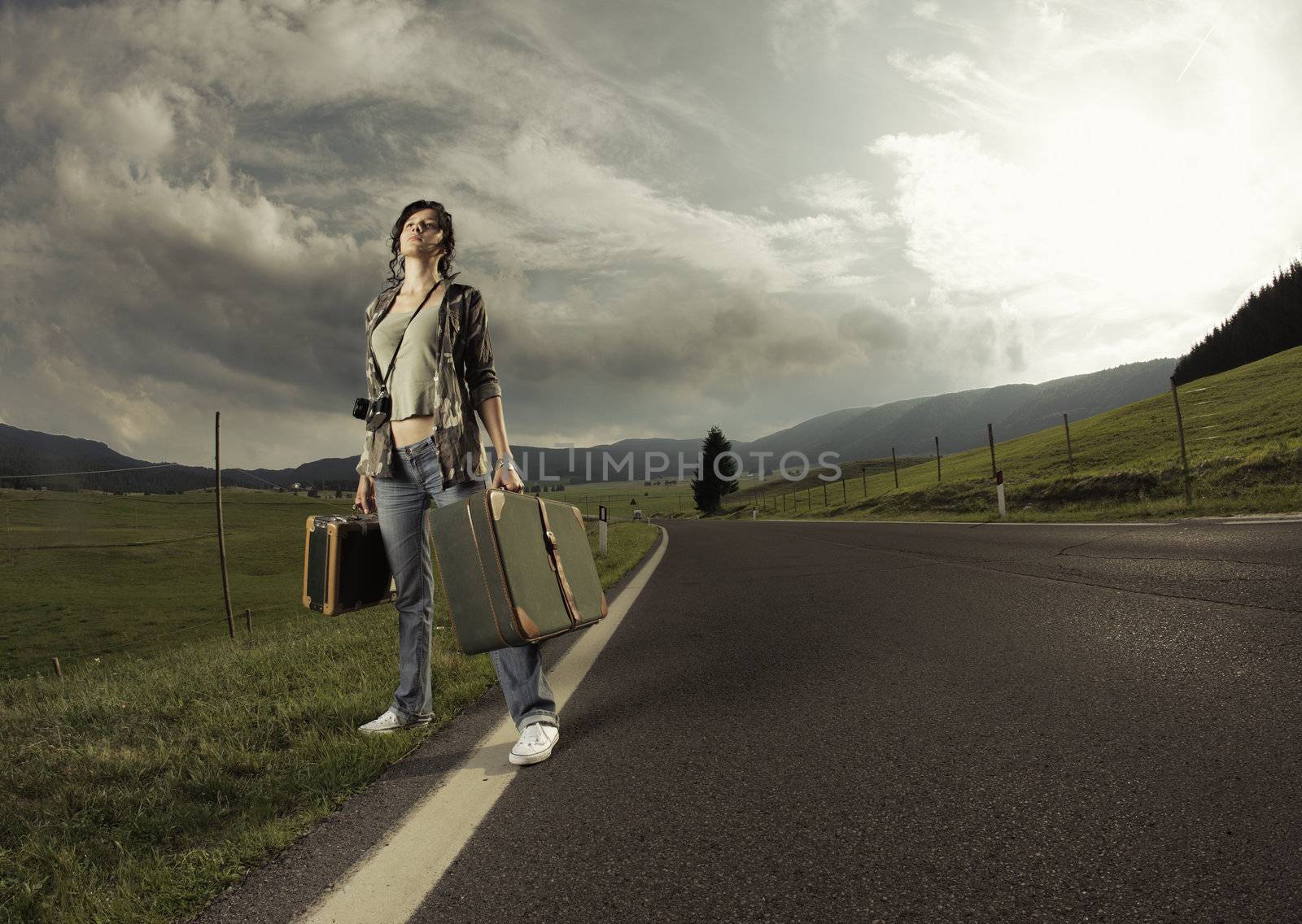 Young woman with old suitcase is ready to start. Copy space