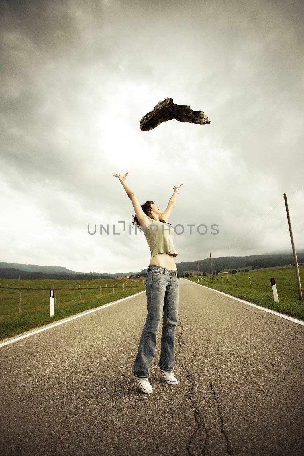 Young woman on the long empty street.