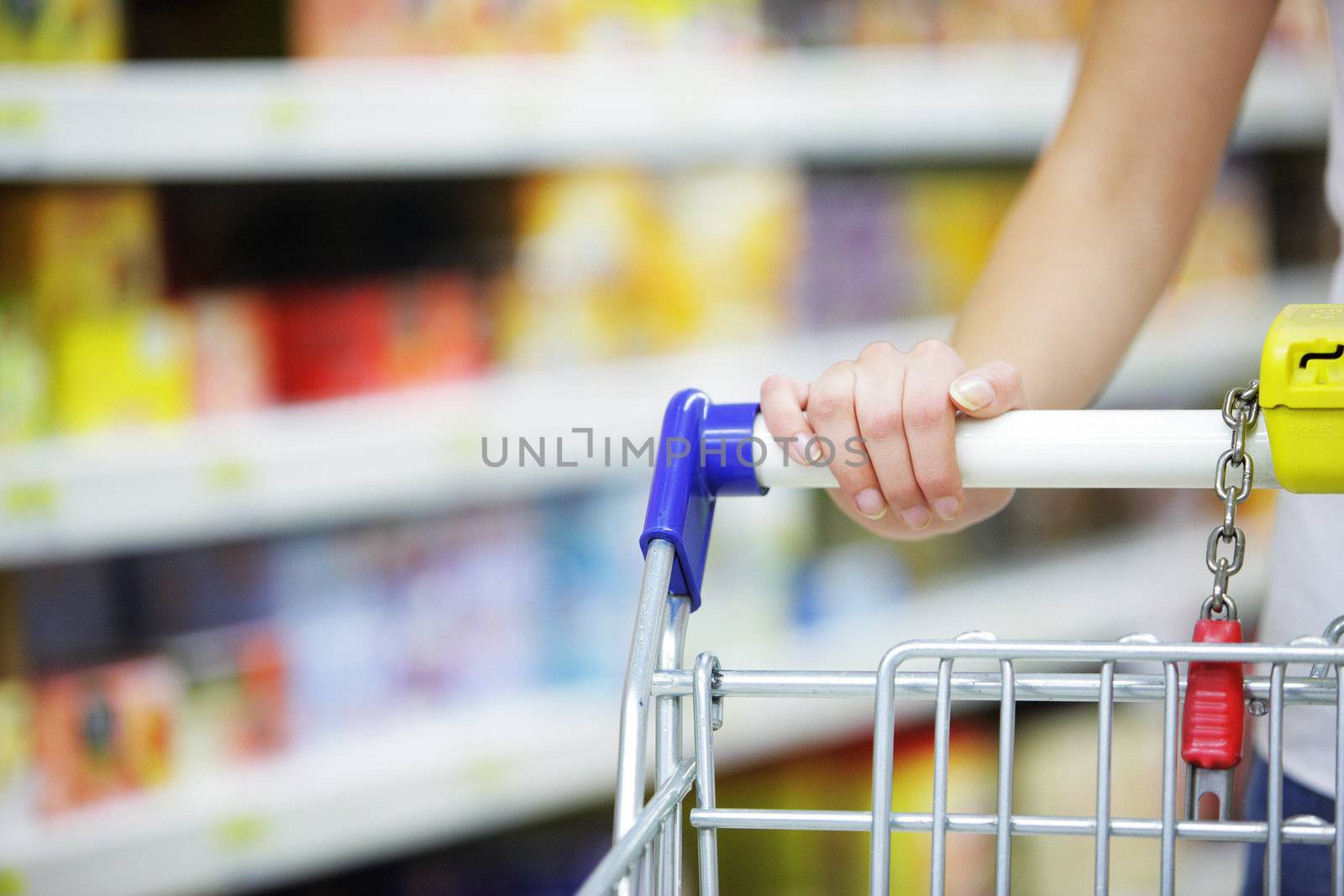 Woman with shopping cart, close up