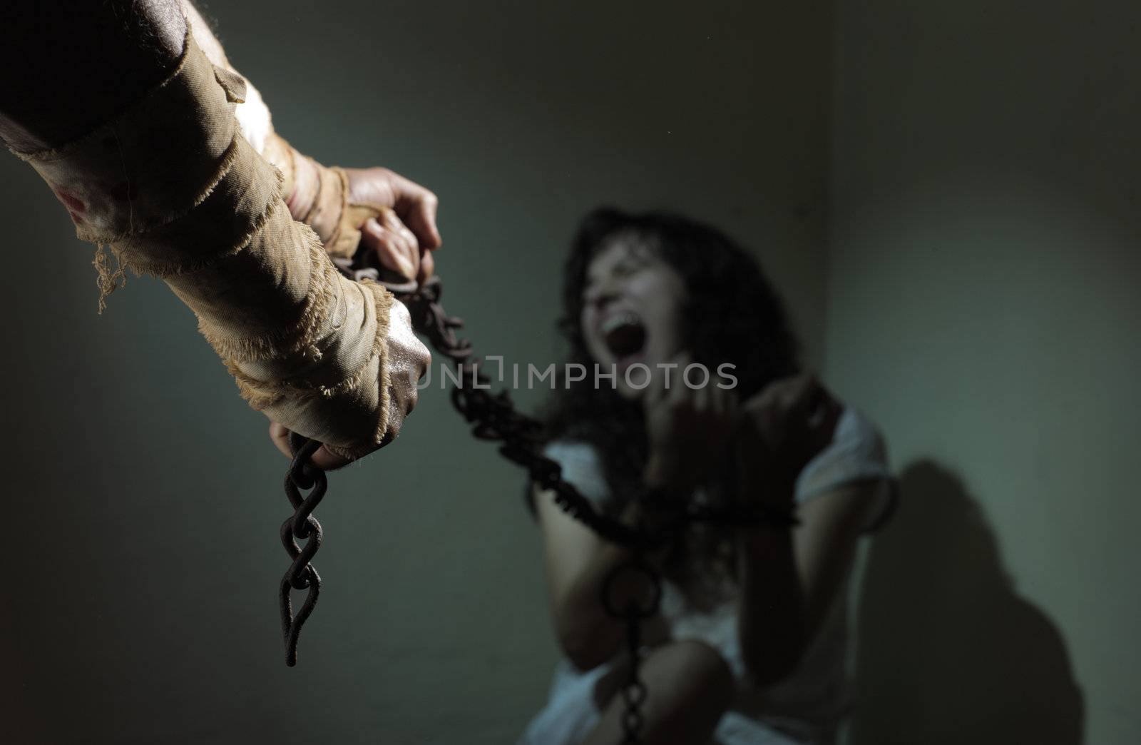 Chained slave woman,  prisoner of an evil man