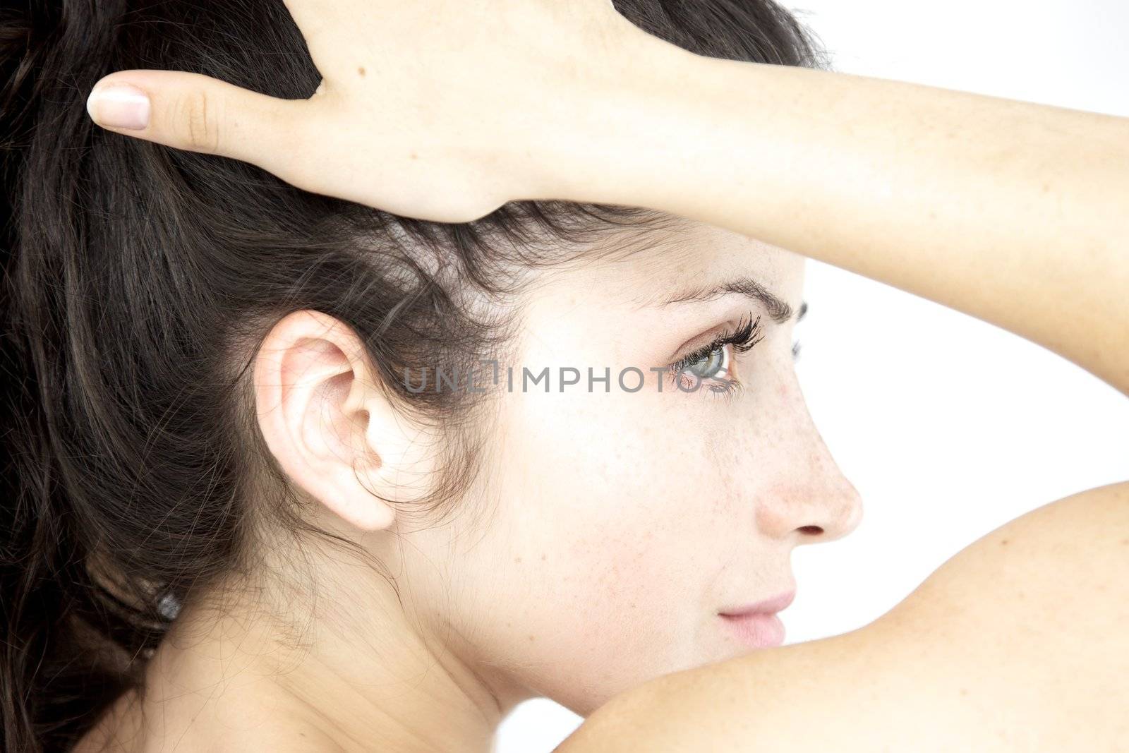 Beautiful young woman portrait profile serious white by fmarsicano