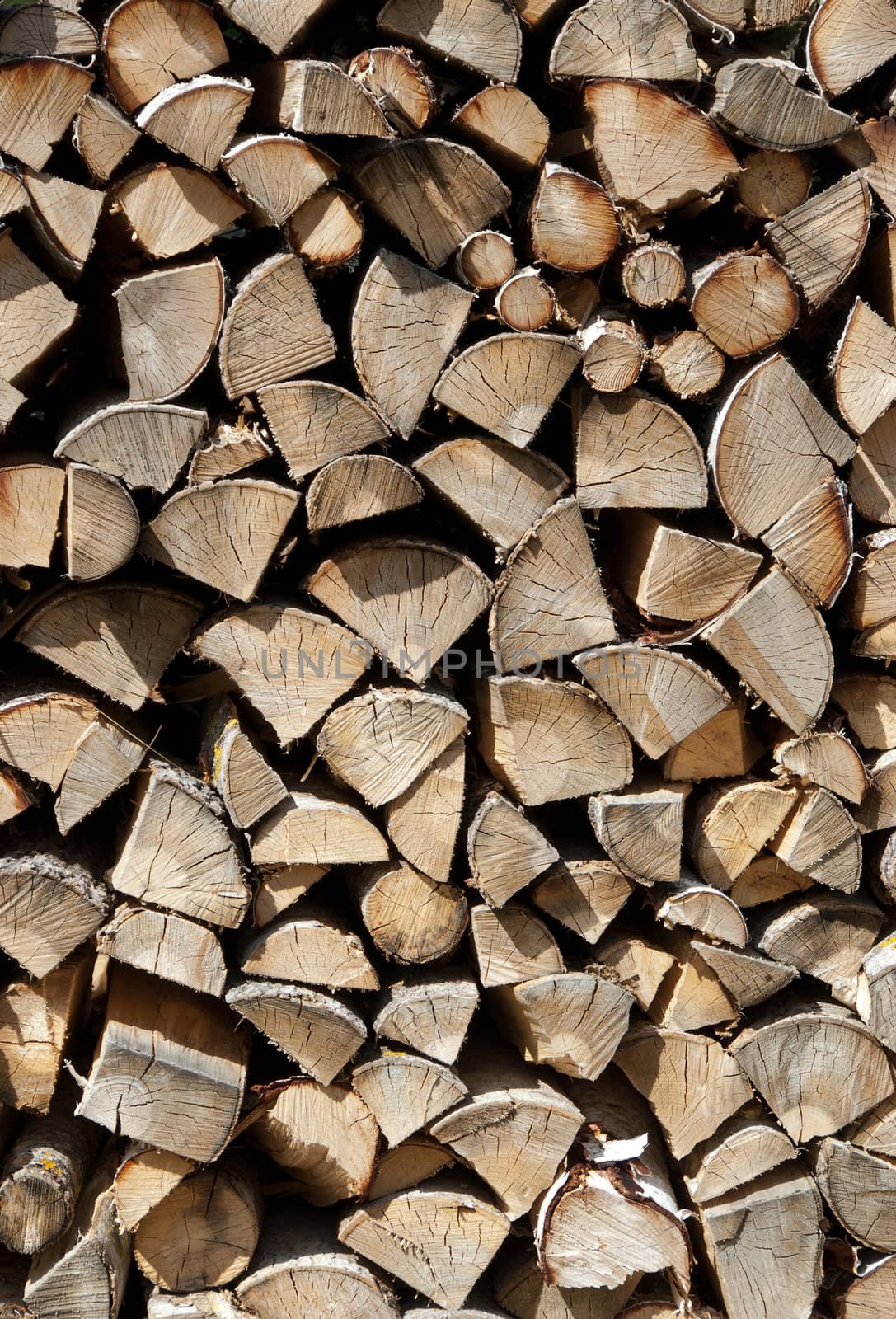 Chopped wood stacked in a big pile. Abstract background.