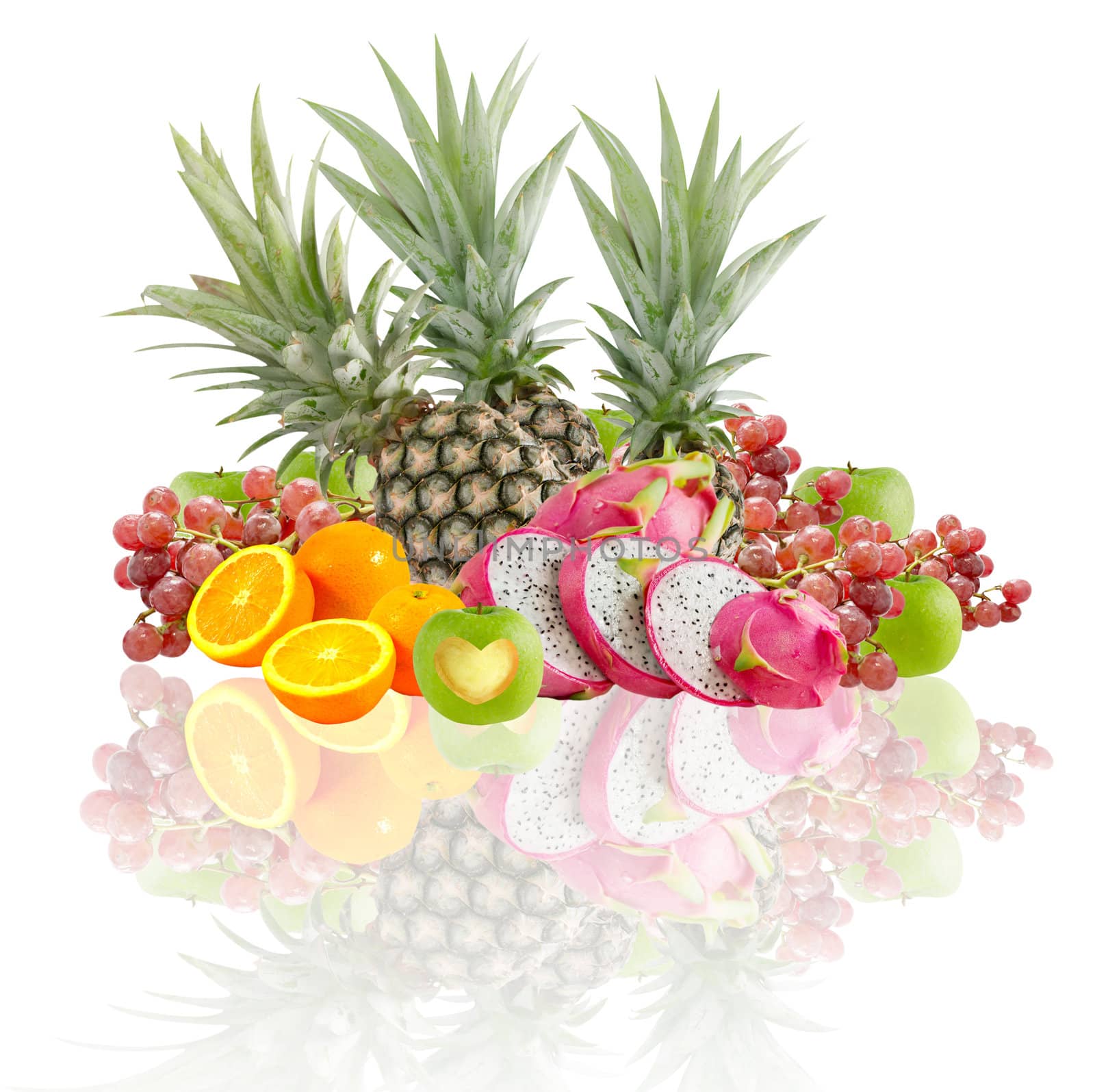 Fresh mix fruits over white background with reflection 