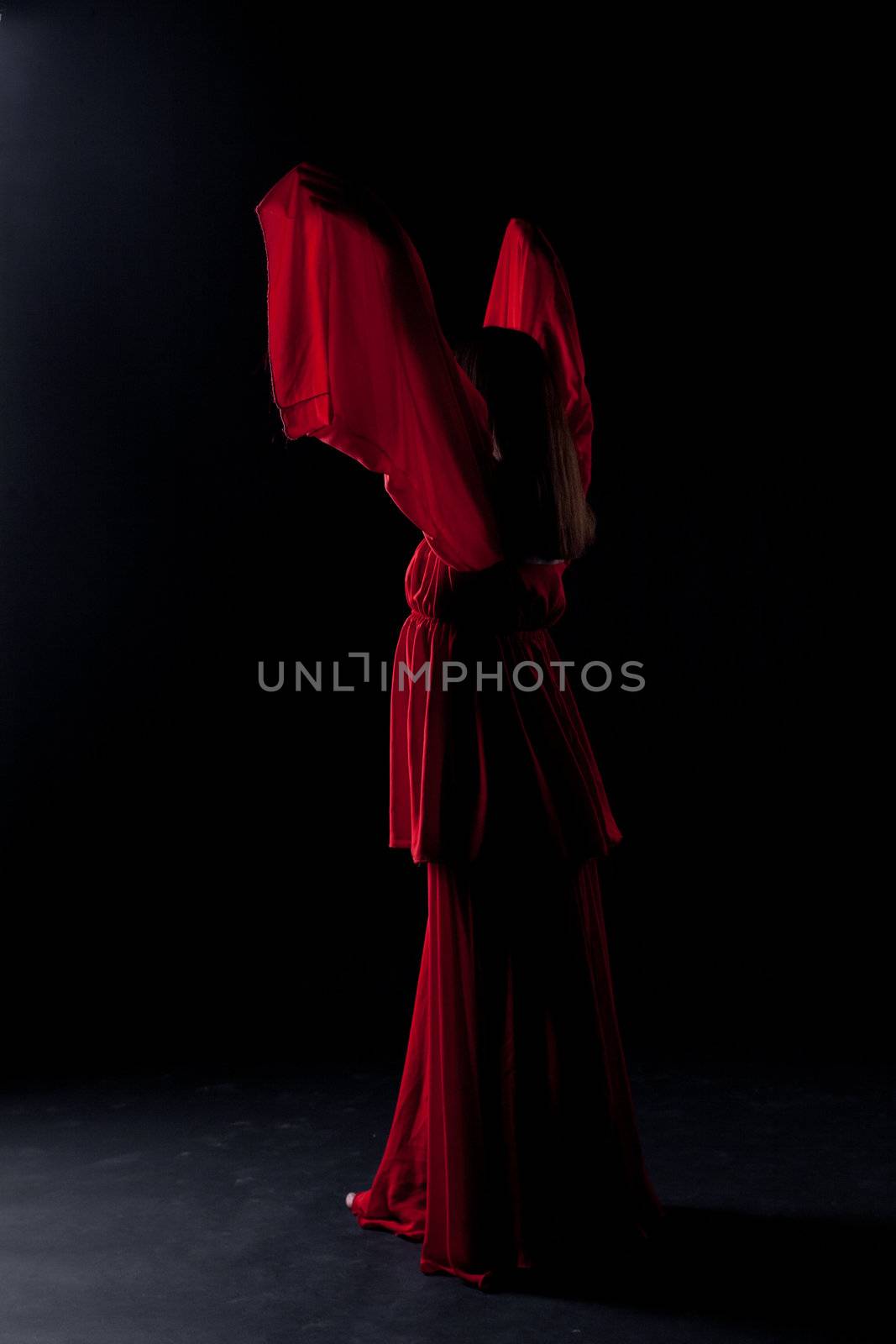 Young girl dancer in a darkness before start
