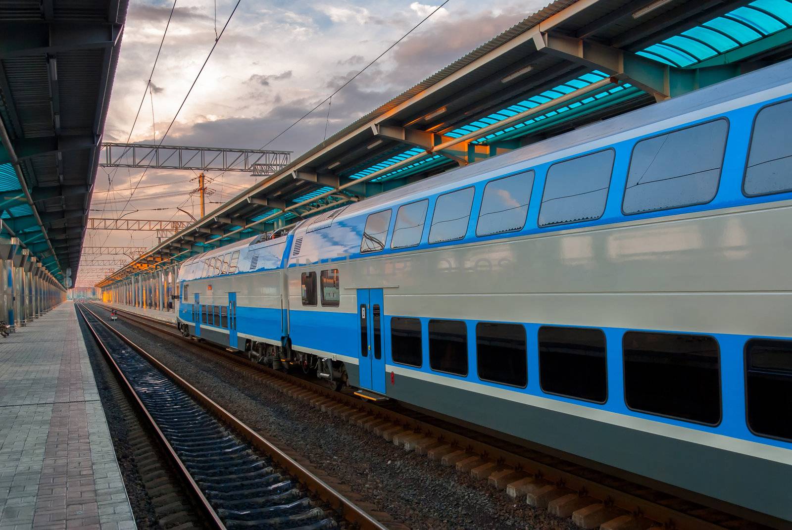 High-speed commuter train at railway station before a start of motion