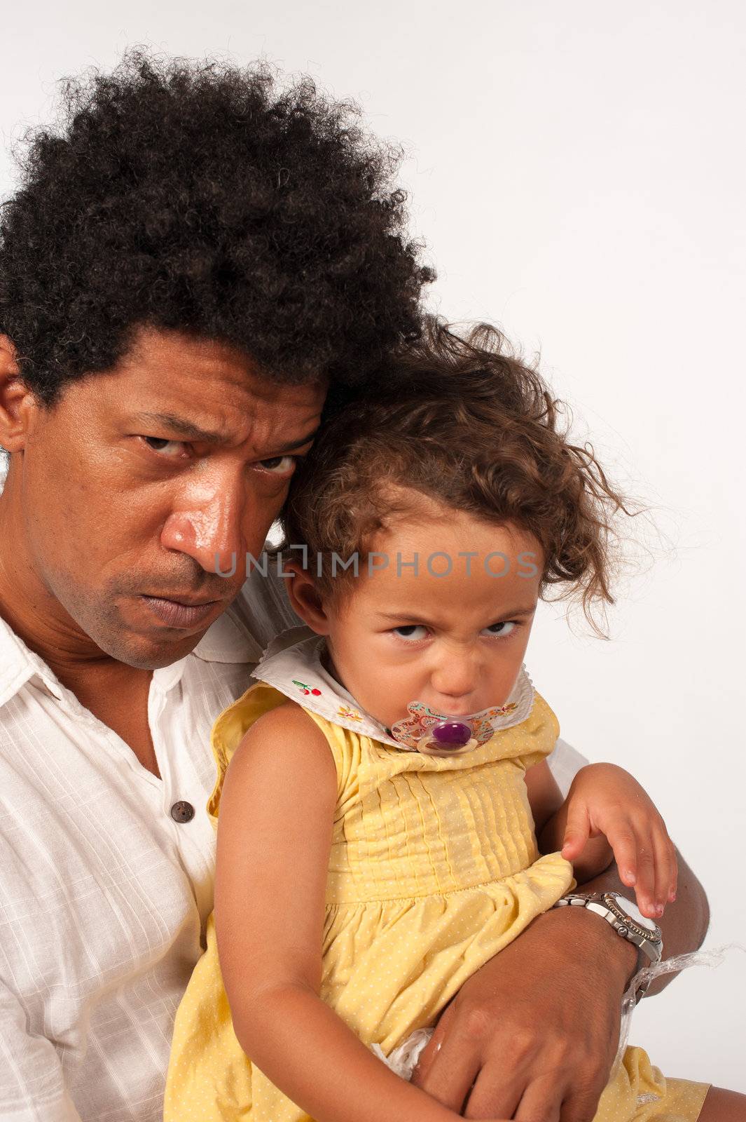 Upset look for the camera from dad and daughter