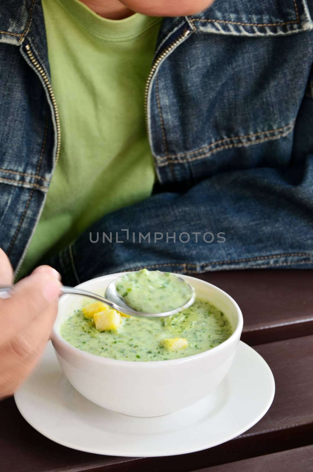 Spinach soup on the wooden table