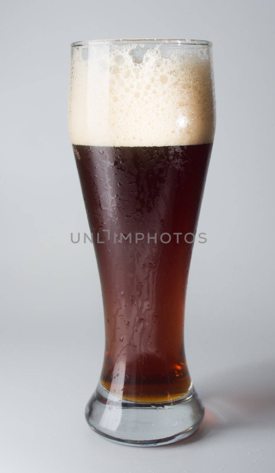 Mug, full of cold ale beer. Isolated.