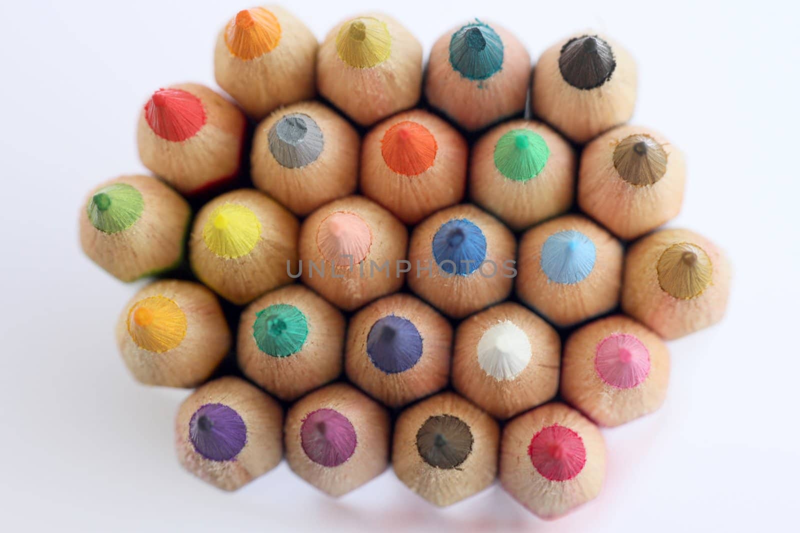 An extreme macro view of colour pencils arranged in a row