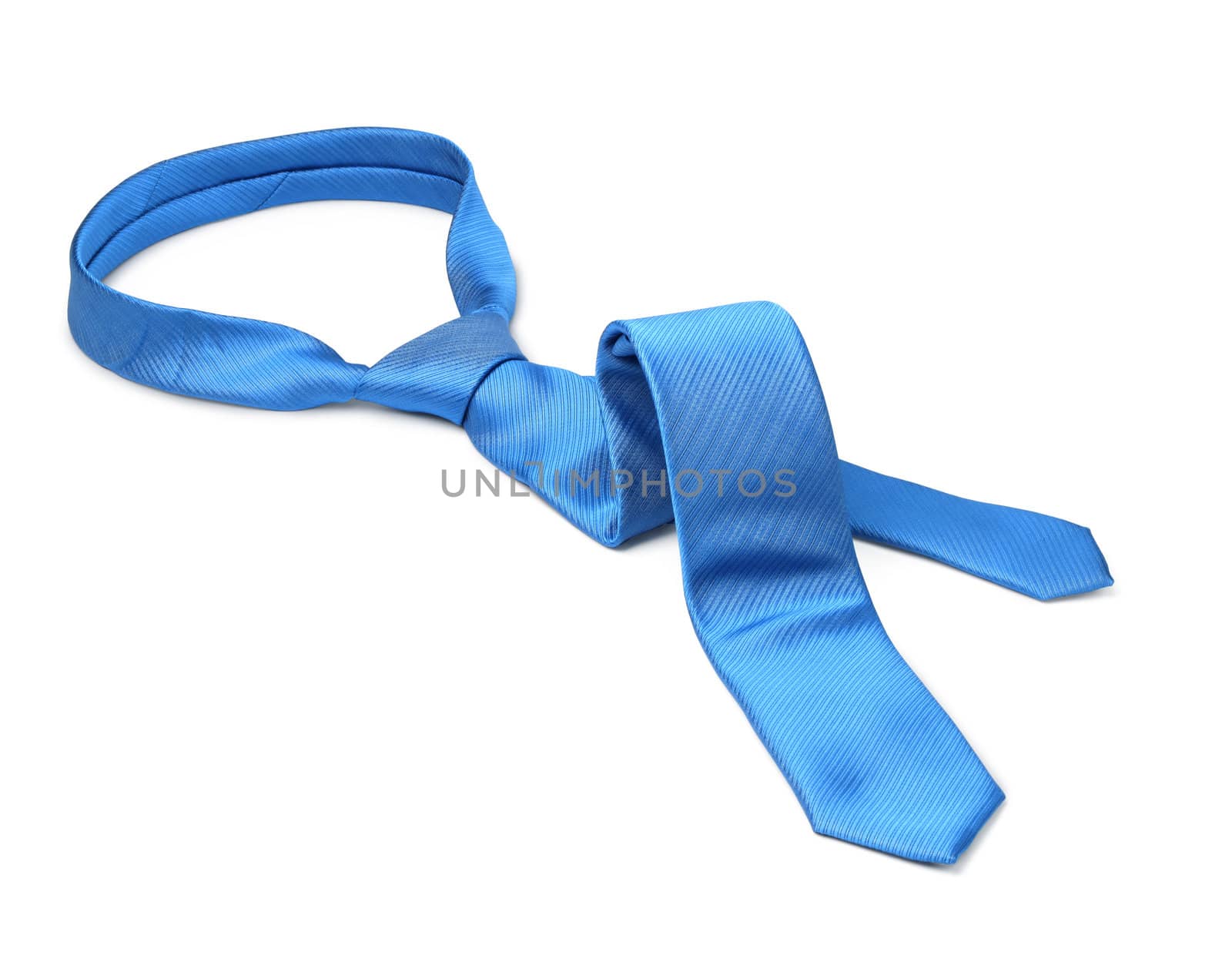 Blue men's tie taken off for leisure time, white background isolated