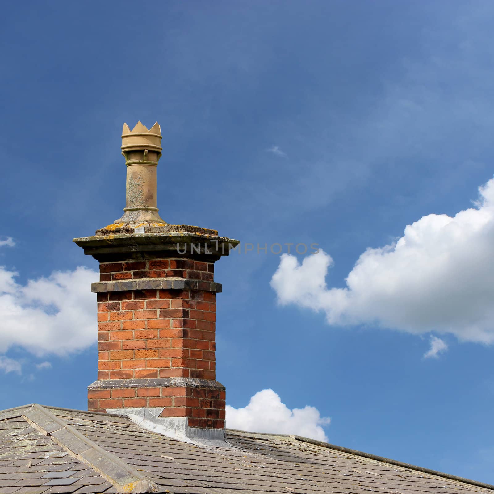 A Roof Top with Red Brick Chimney