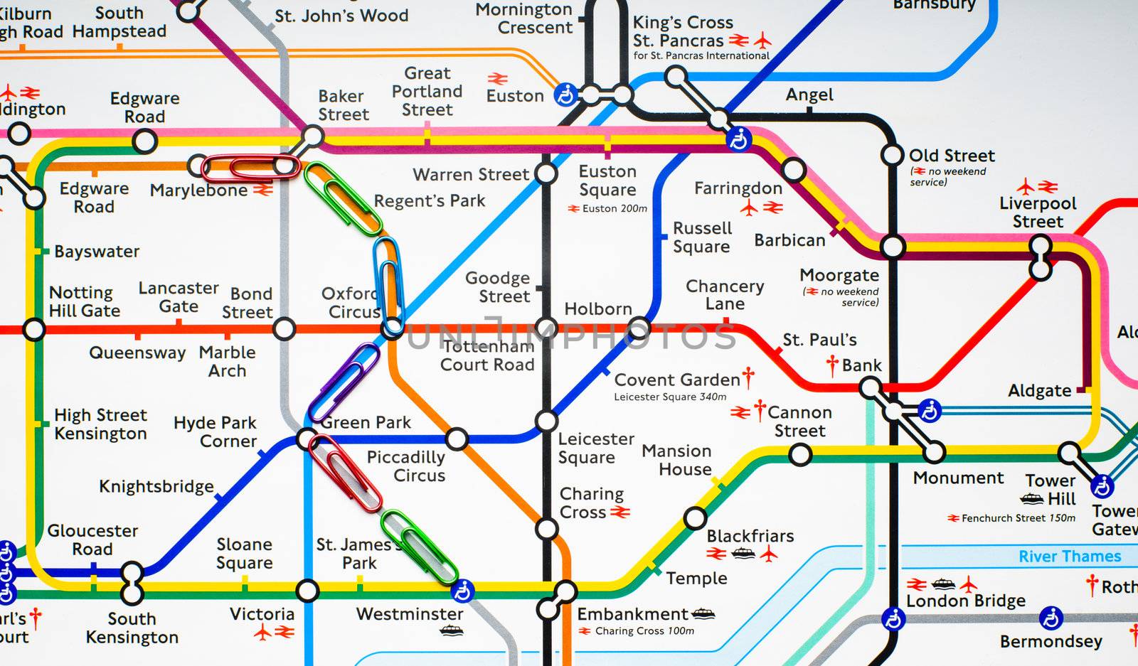 Variegated paperclips on the map of London metro