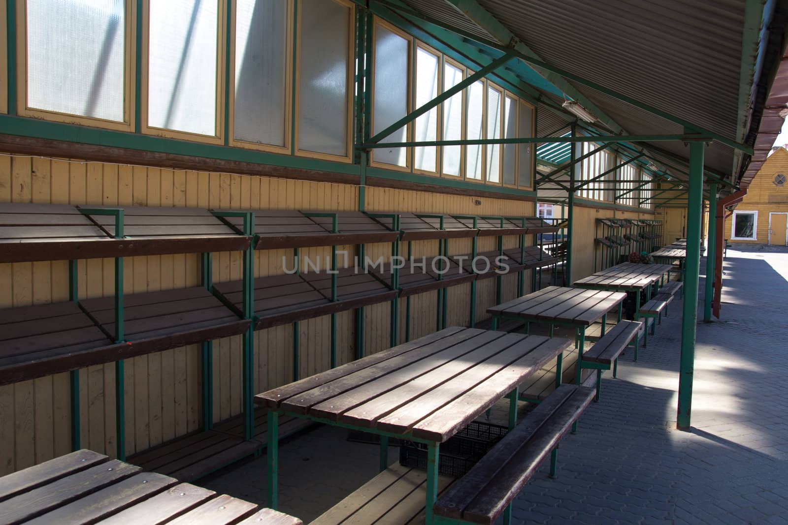 empty tables at a closed farmer market