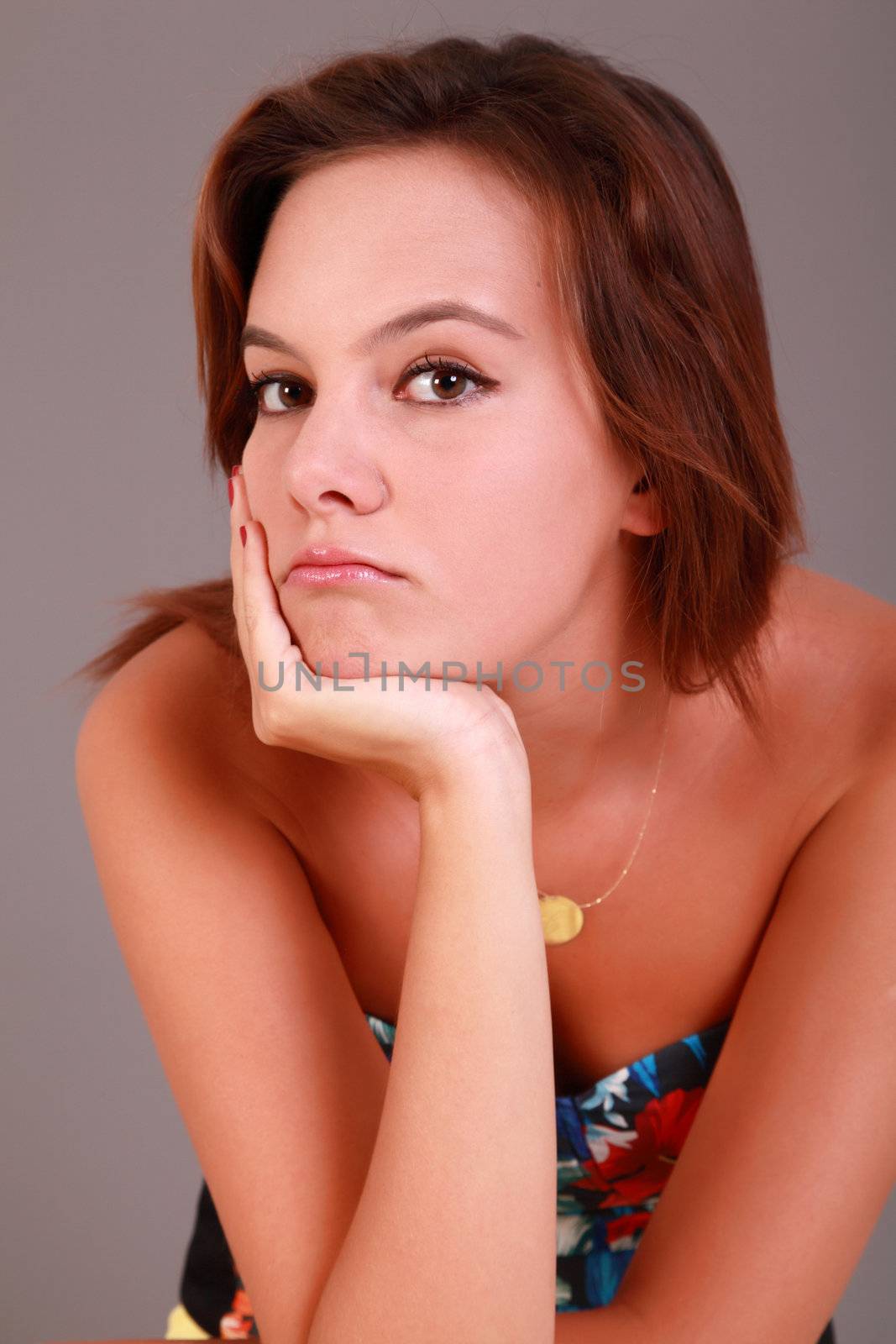 Vertical portrait of young female bored