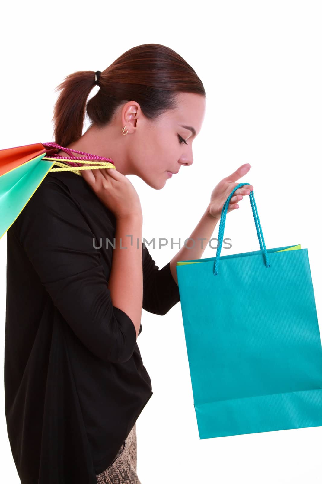Young woman with colorful shopping bags isolated