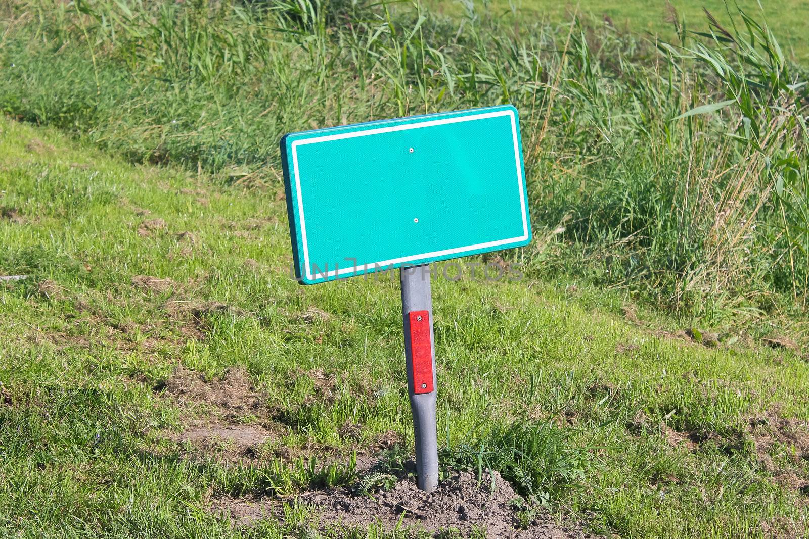 Road sign on the side of the road by NickNick