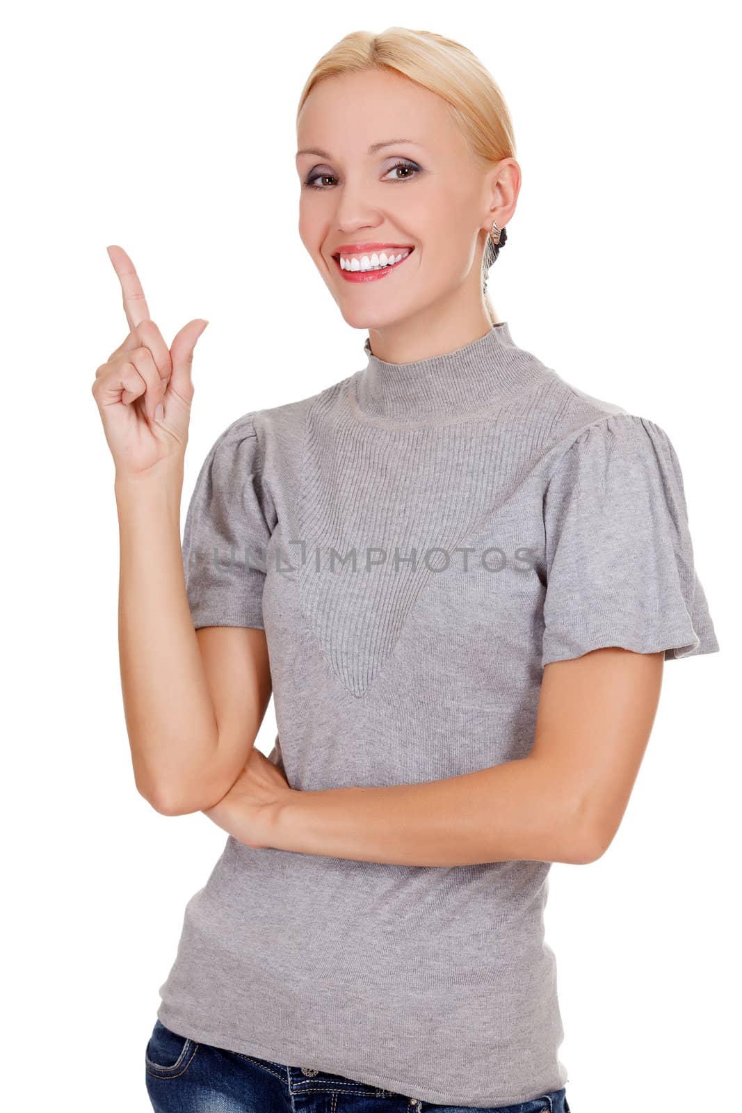 happy young business woman pointing at something interesting against white background