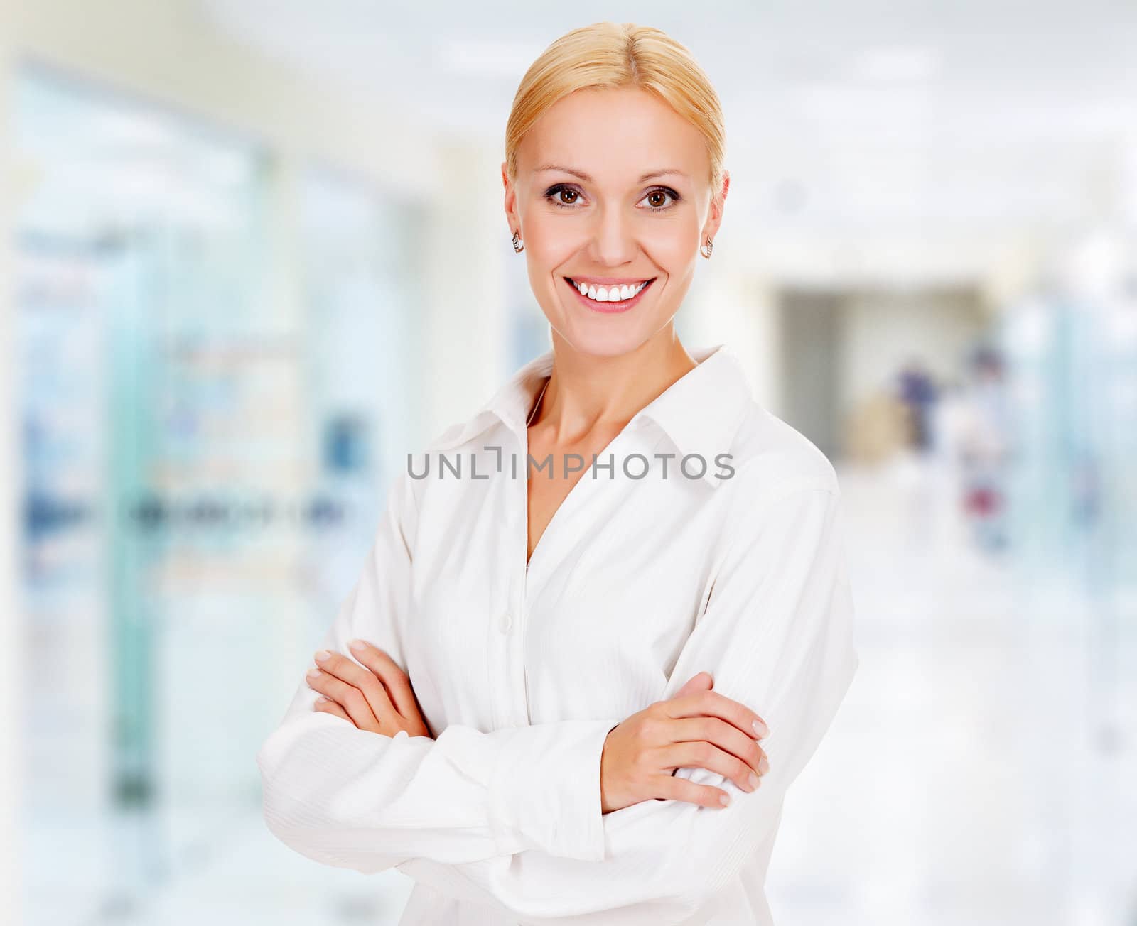 young business woman in the office smiling to you