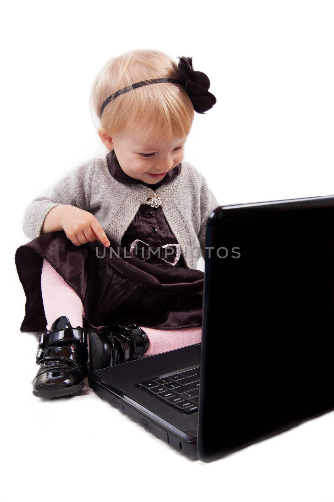 Smiling little girl with laptop by Angel_a