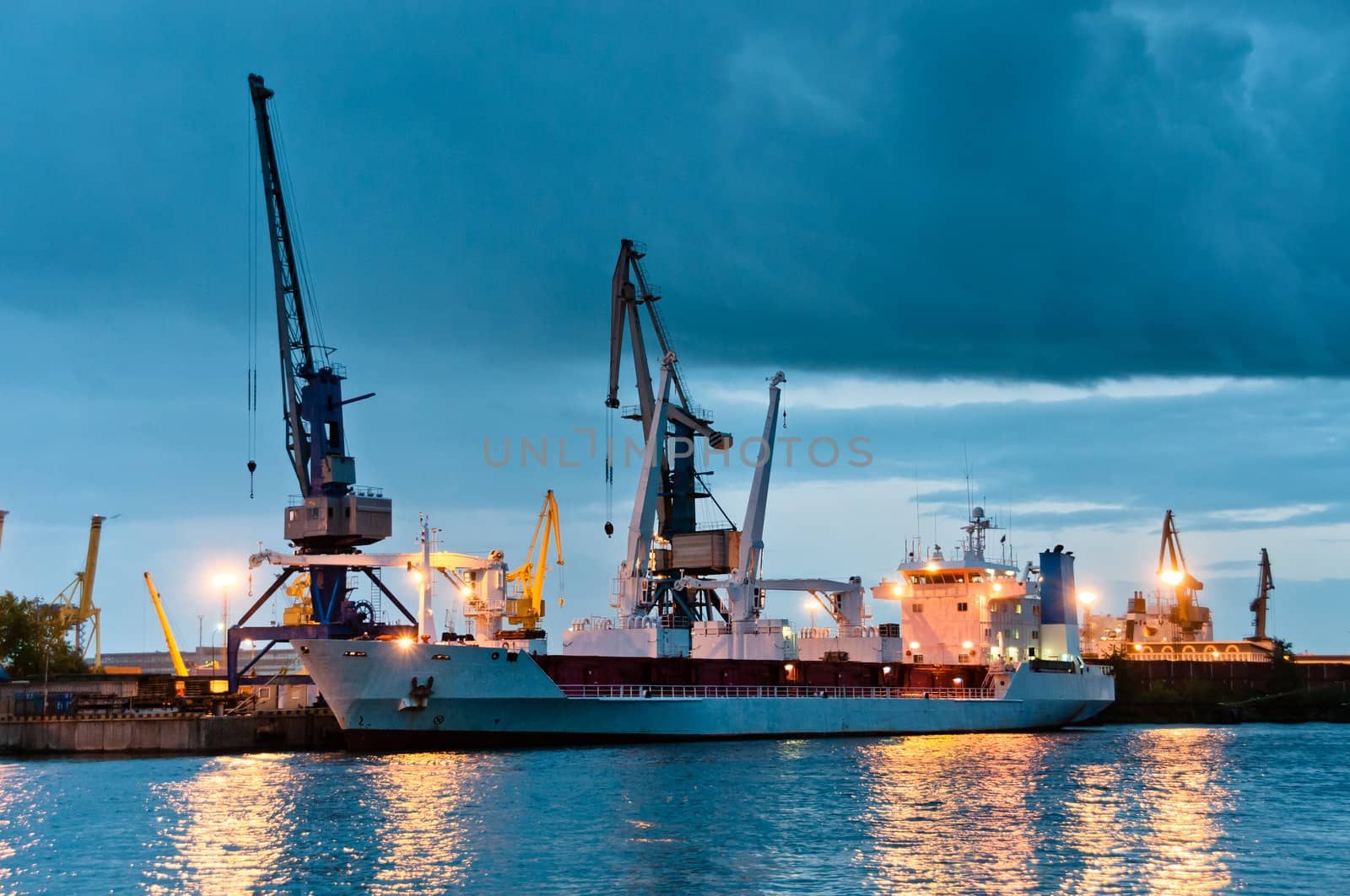 Shipyard with ship at dusk time with beautiful cloudscape