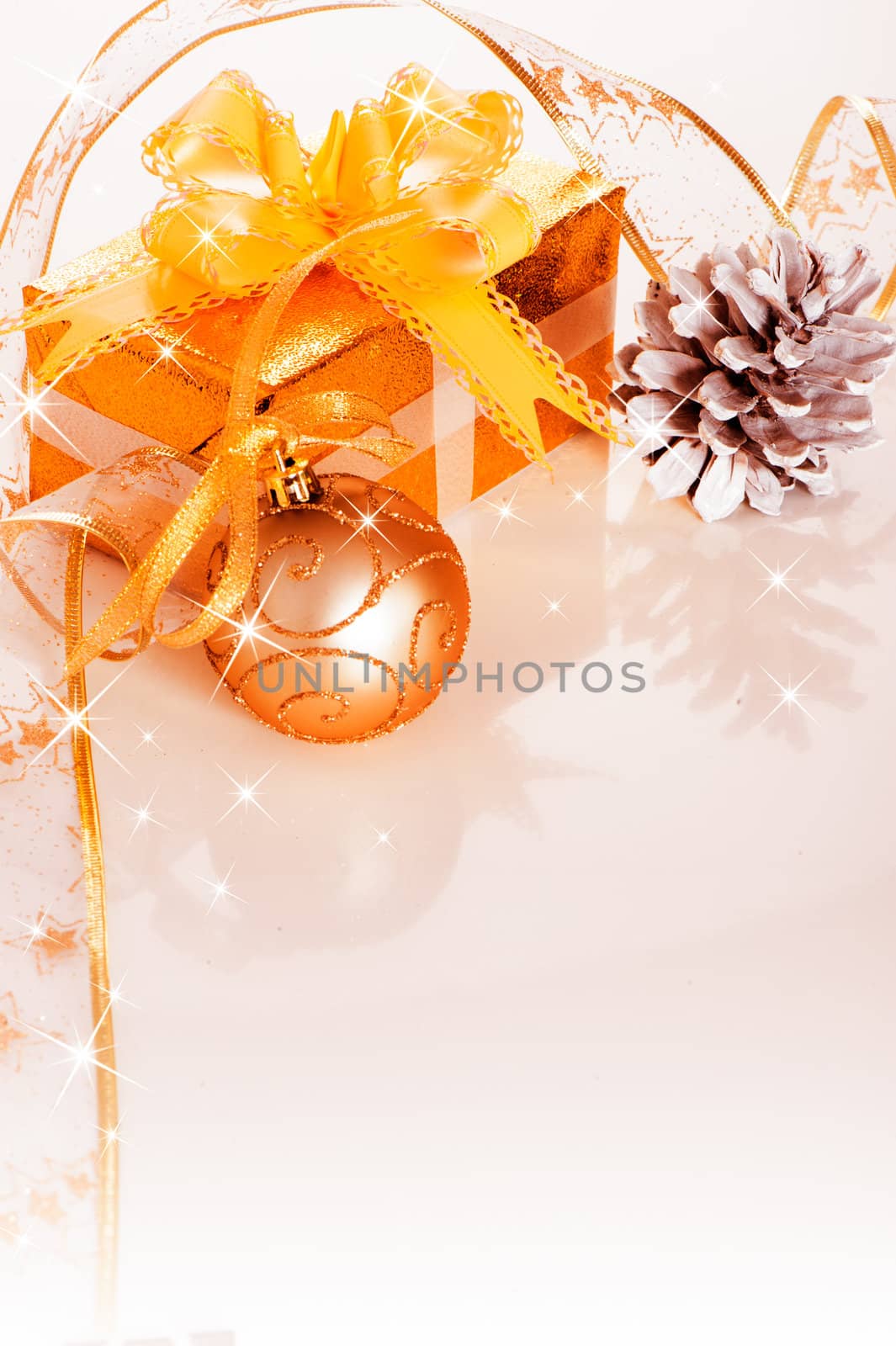 Christmas gift box with decoration on white background