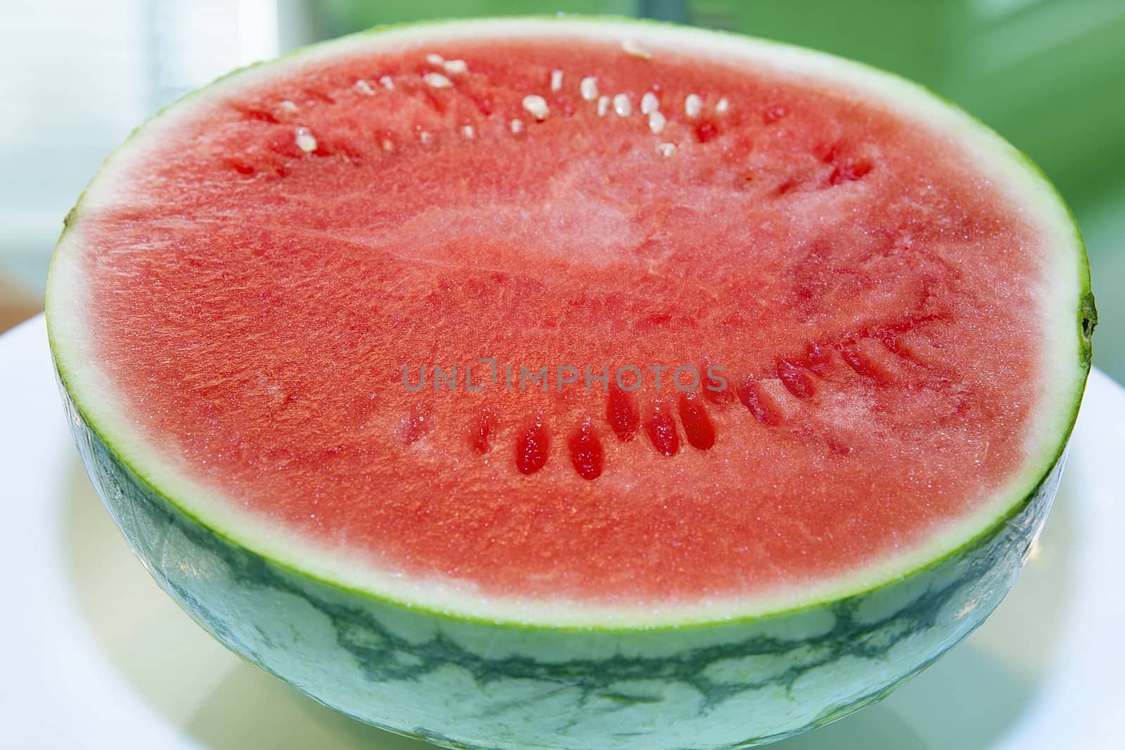 Organic Mini Seedless Watermelon Cut in Half Closeup Macro