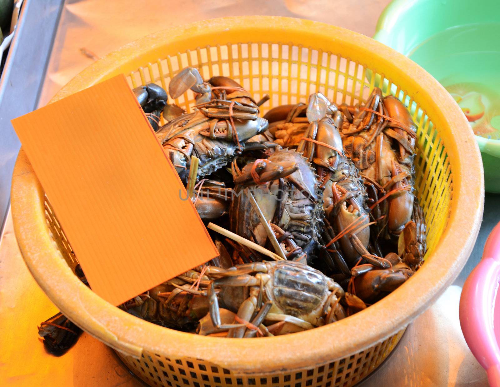 Crabs in basket for sale, seafood markets  by siraanamwong