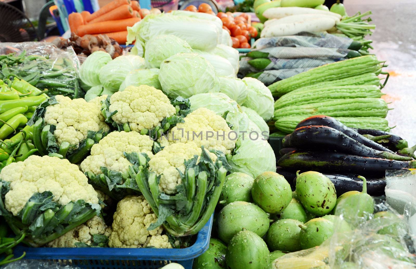 Assorted fruit and vegetable trays in the market, thailand