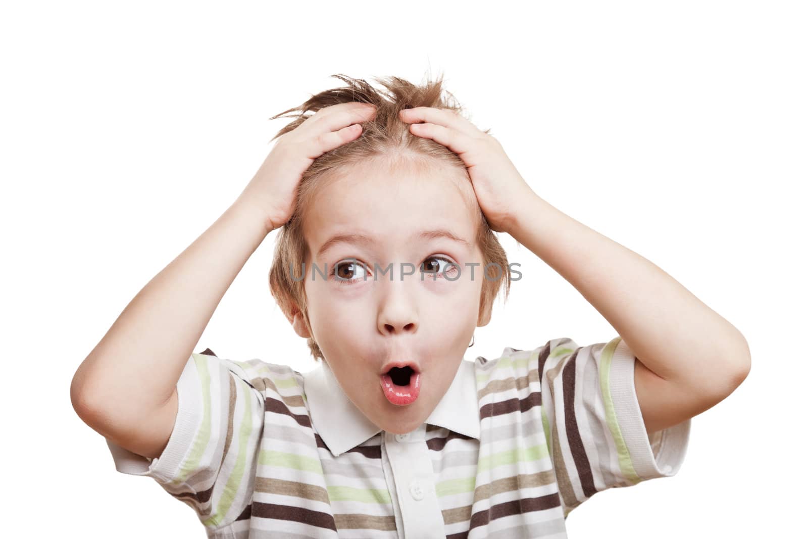 Amazed or surprised child boy hand holding hairs on head