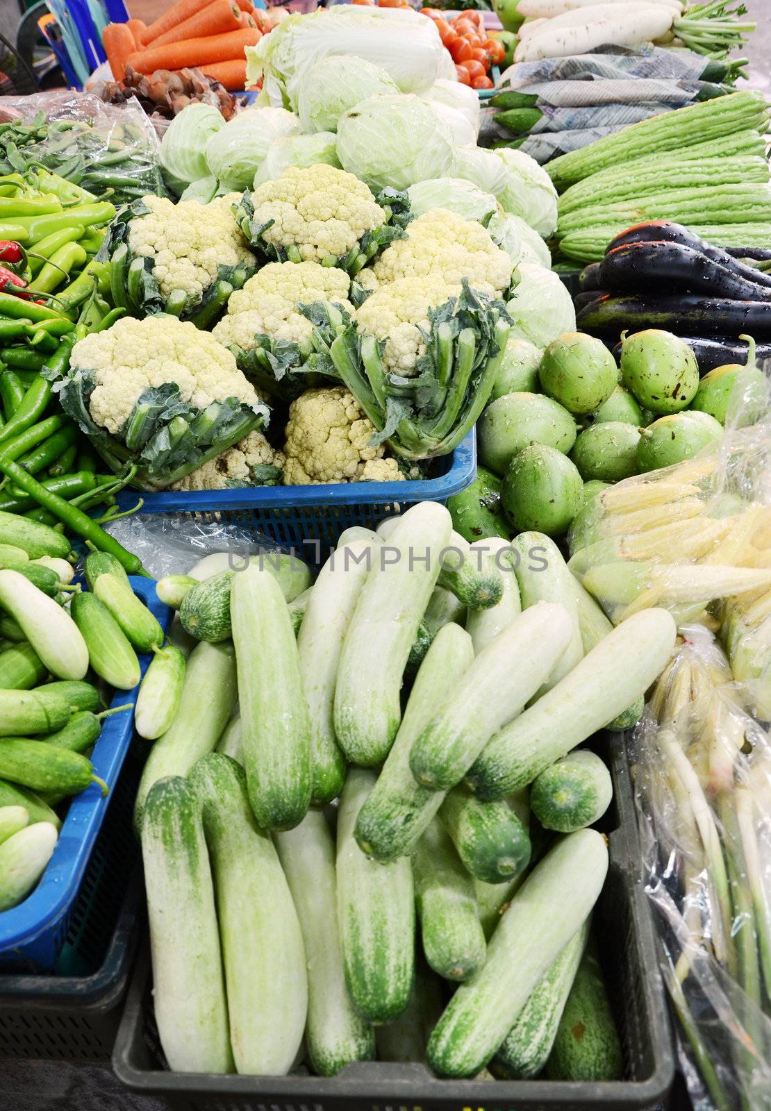 Vegetables at a market by siraanamwong