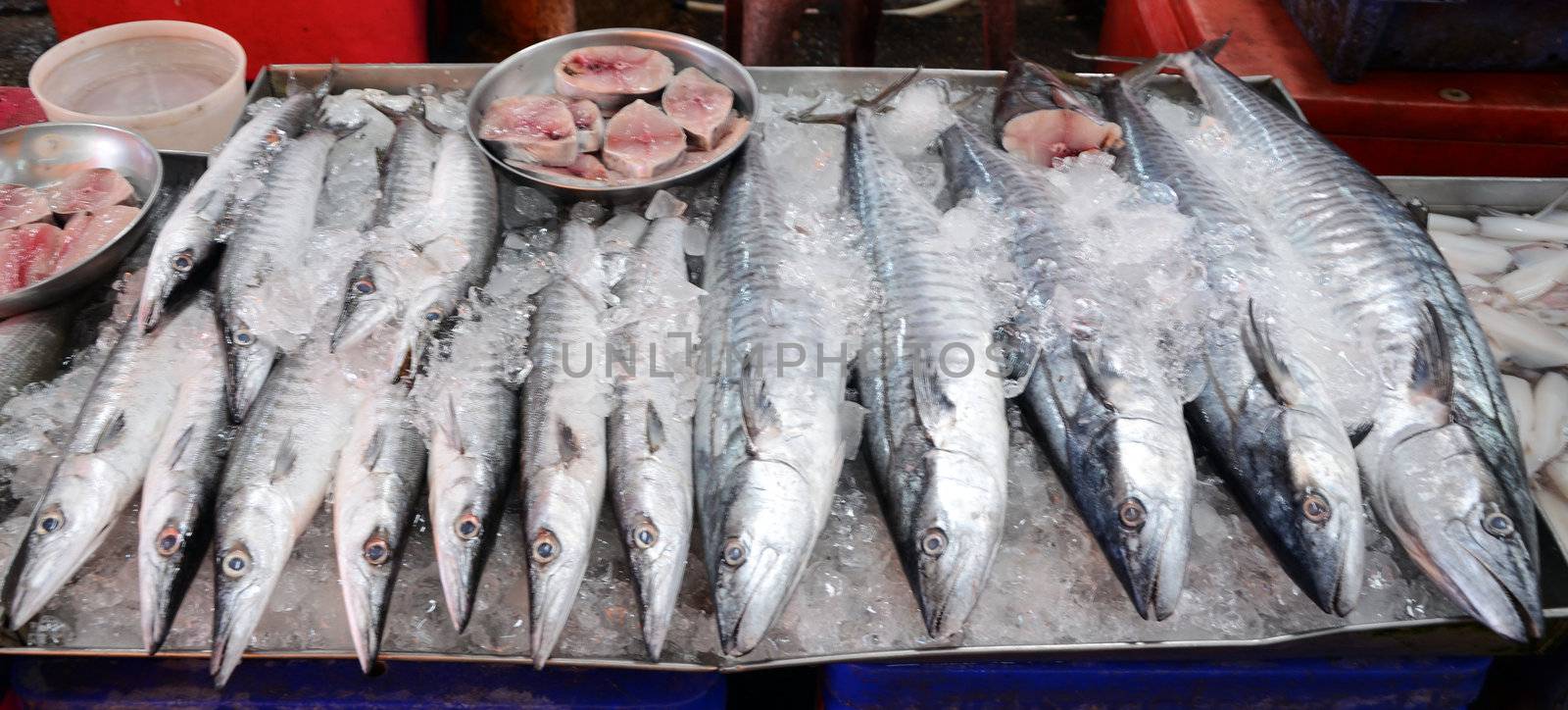 Variety of fresh fish seafood in market by siraanamwong