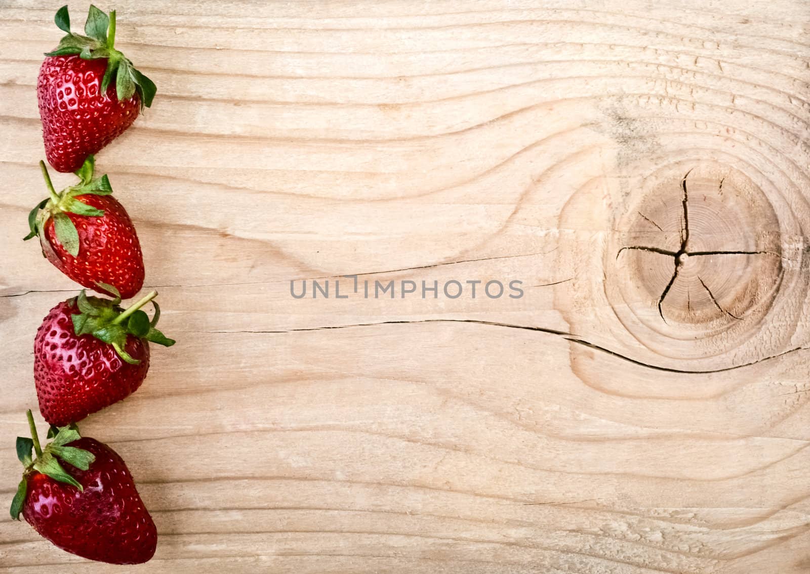 Fresh strawberries on old wooden background by vician
