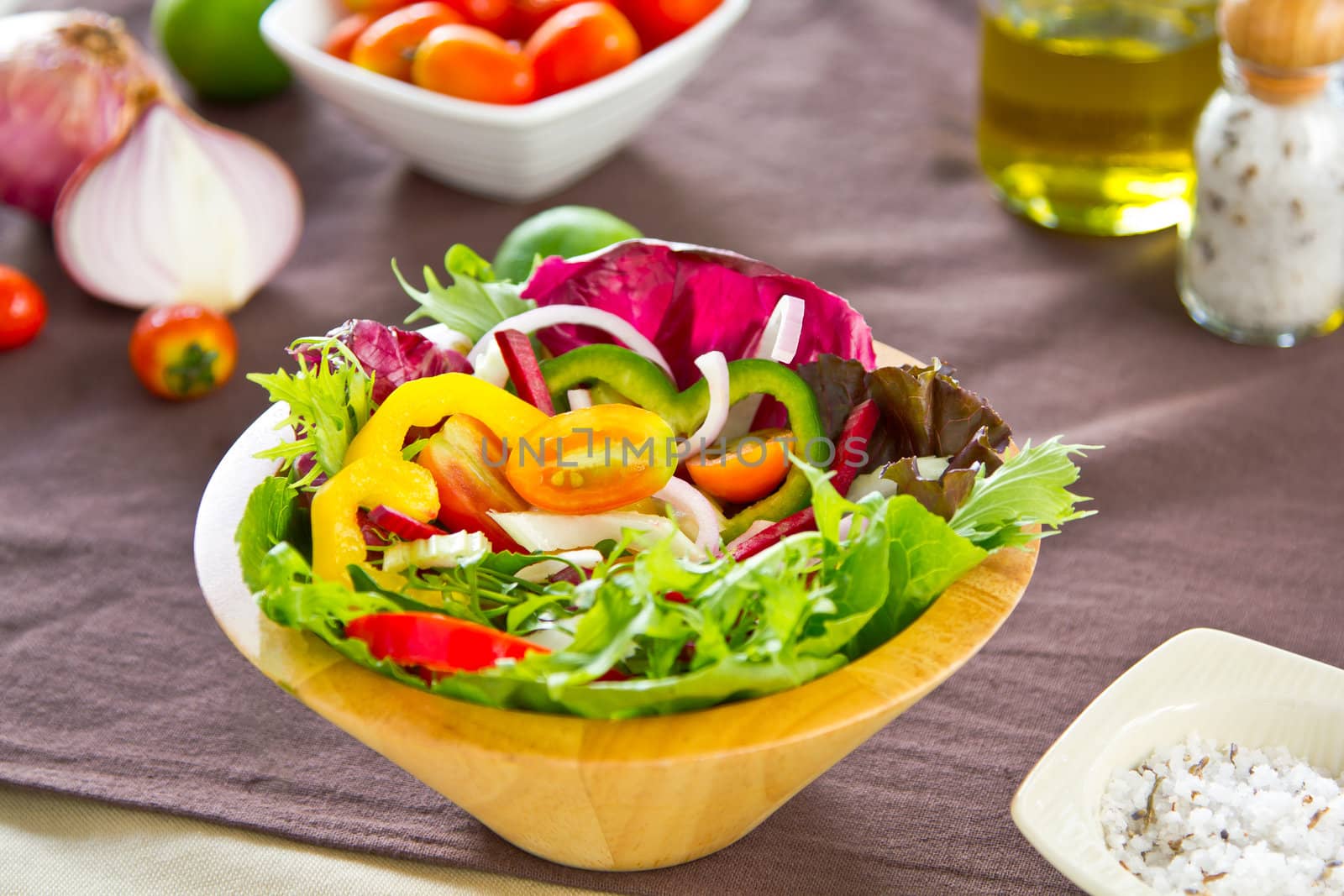 Vegetables salad in wood bowl by vanillaechoes