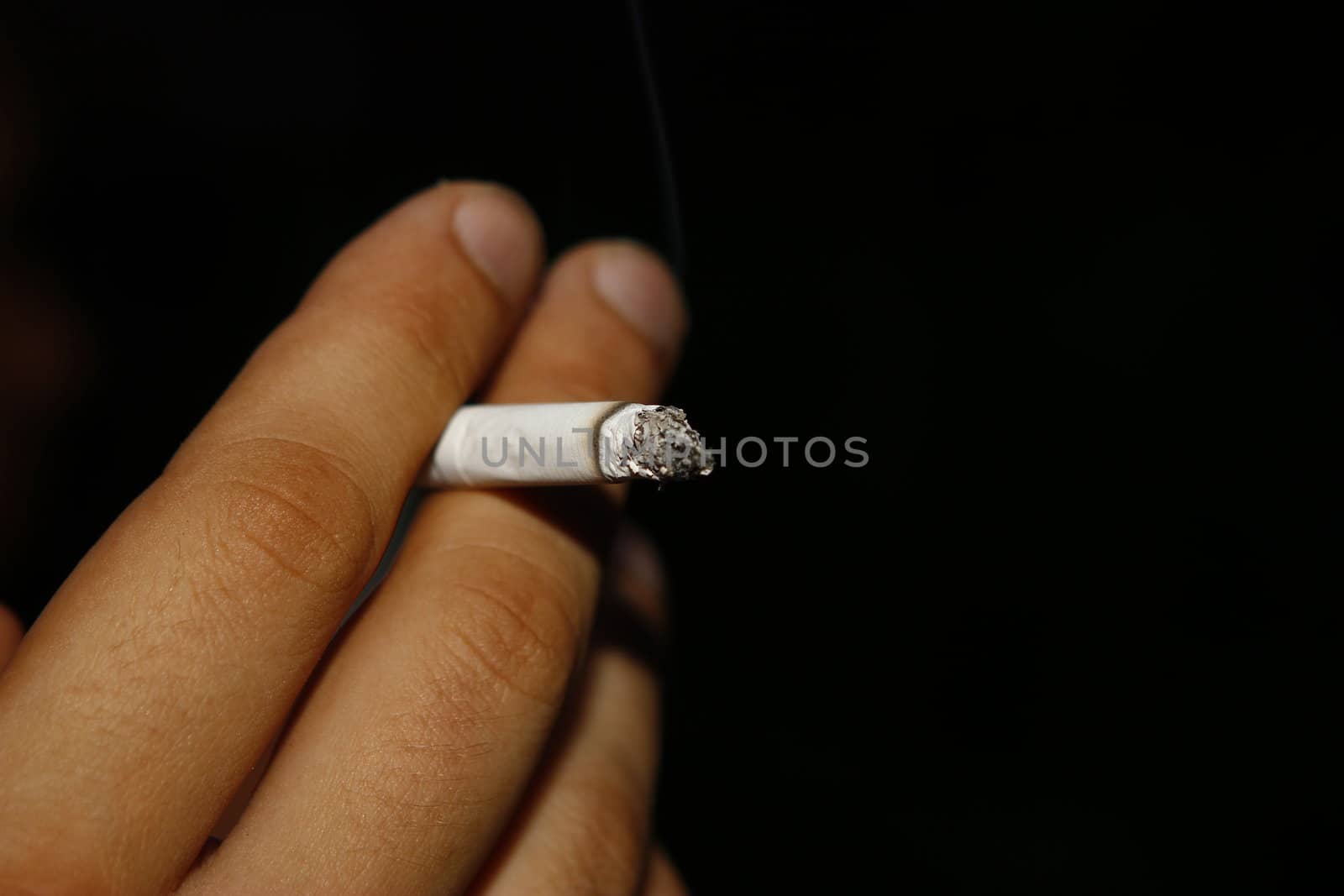 man smoking a cigarette