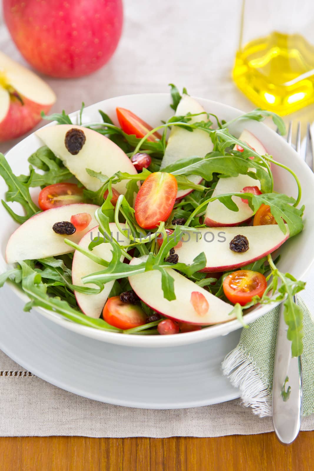 Apple with tomato ,raisin and rocket salad