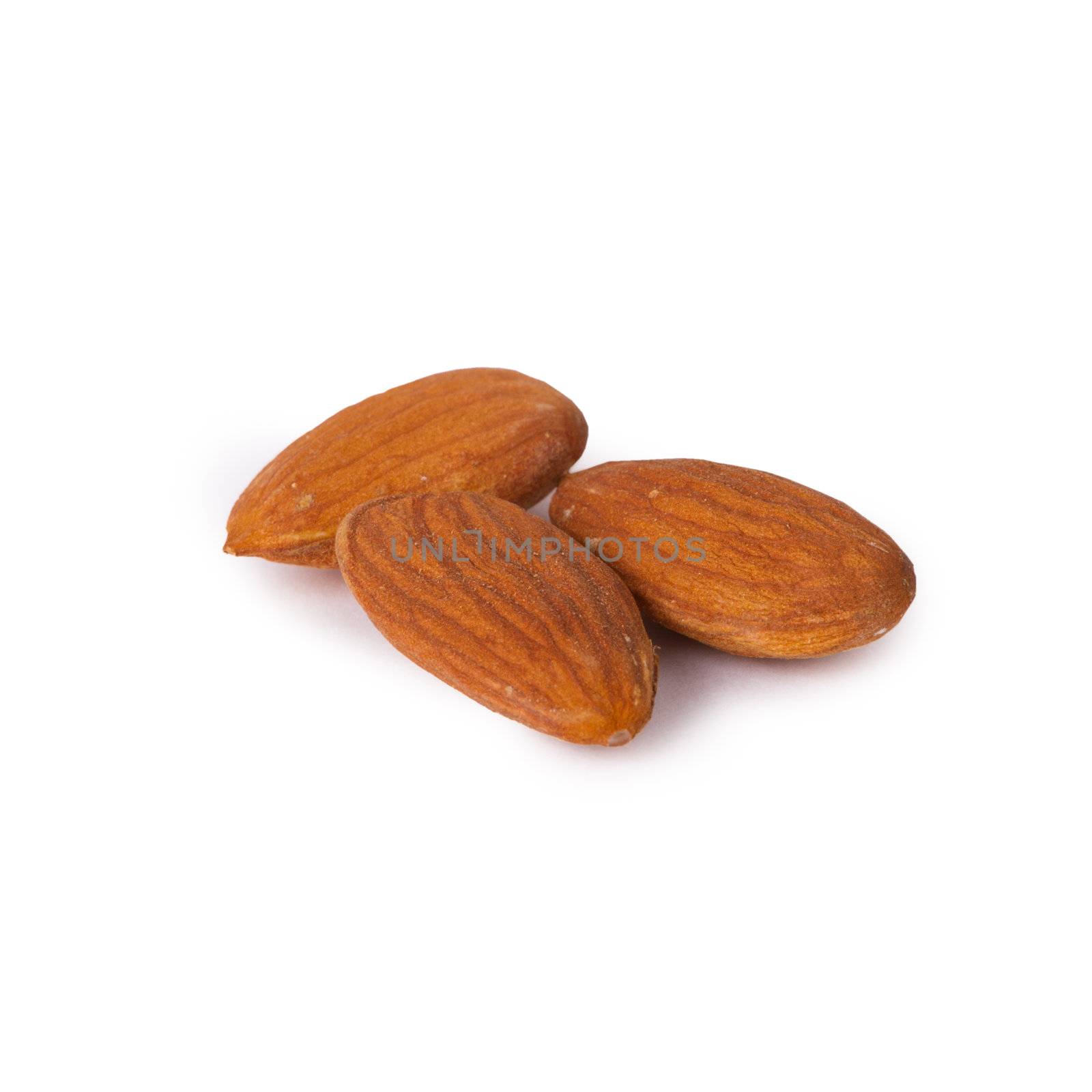 A few raw almonds isolated on white background