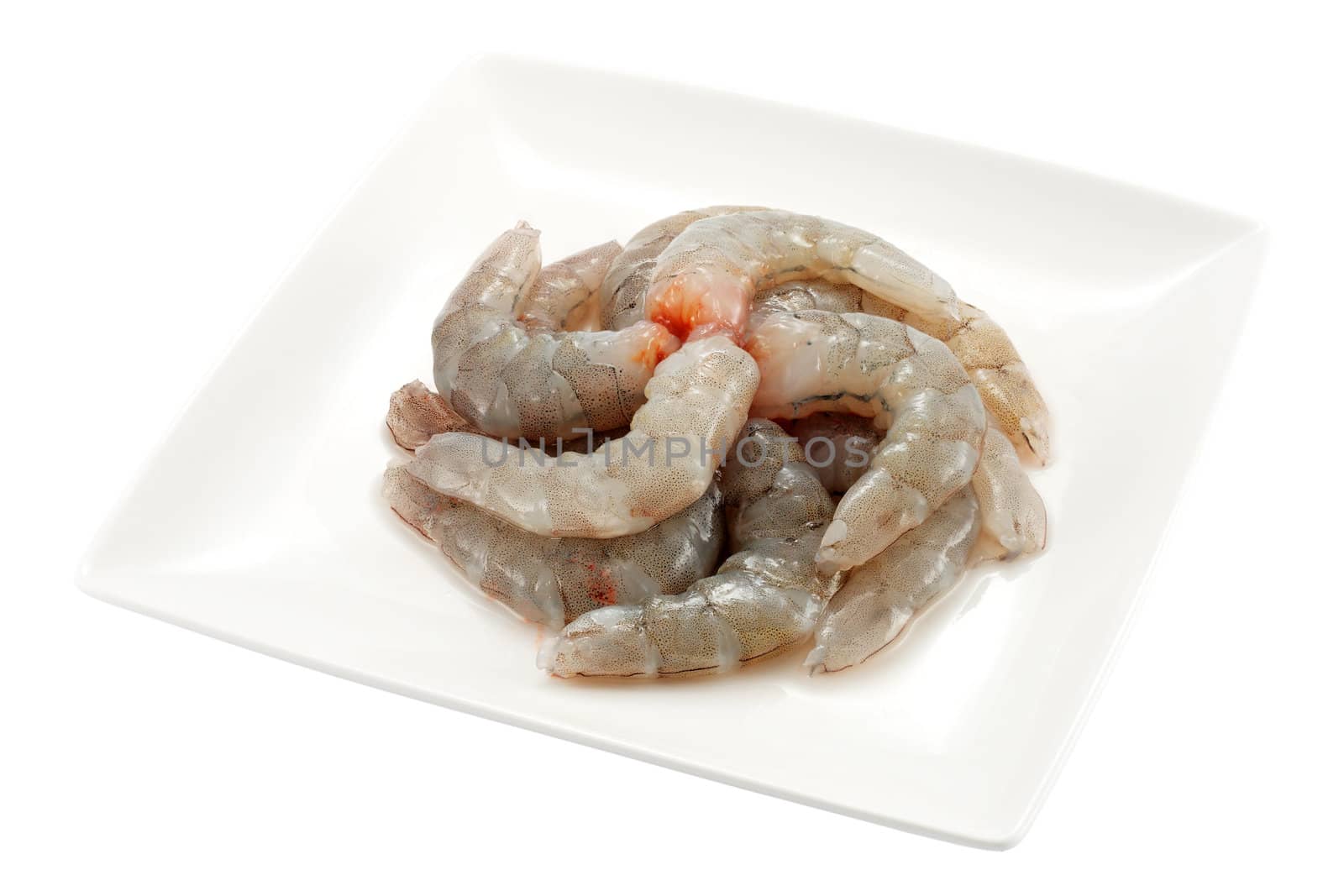 plate peeled prawn tails ready to cook and isolated with clipping path