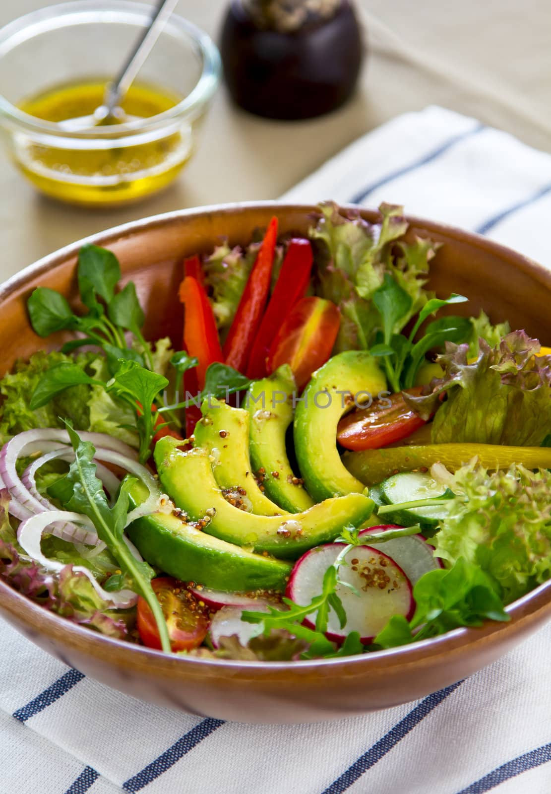 Avocado with pepper,radish and lettuce salad by vinaigrette