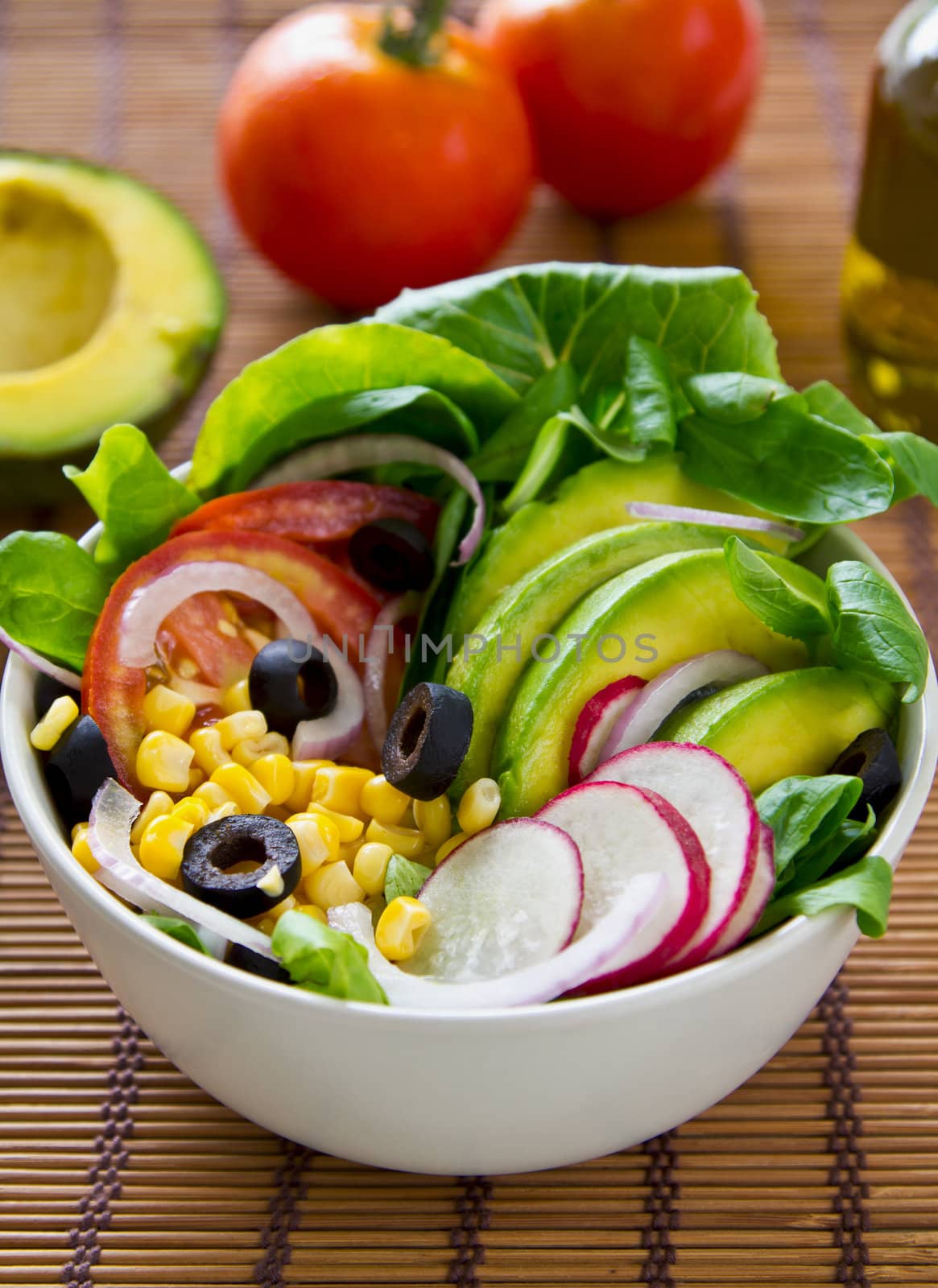 Avocado with sweetcorn ,radish and olive salad