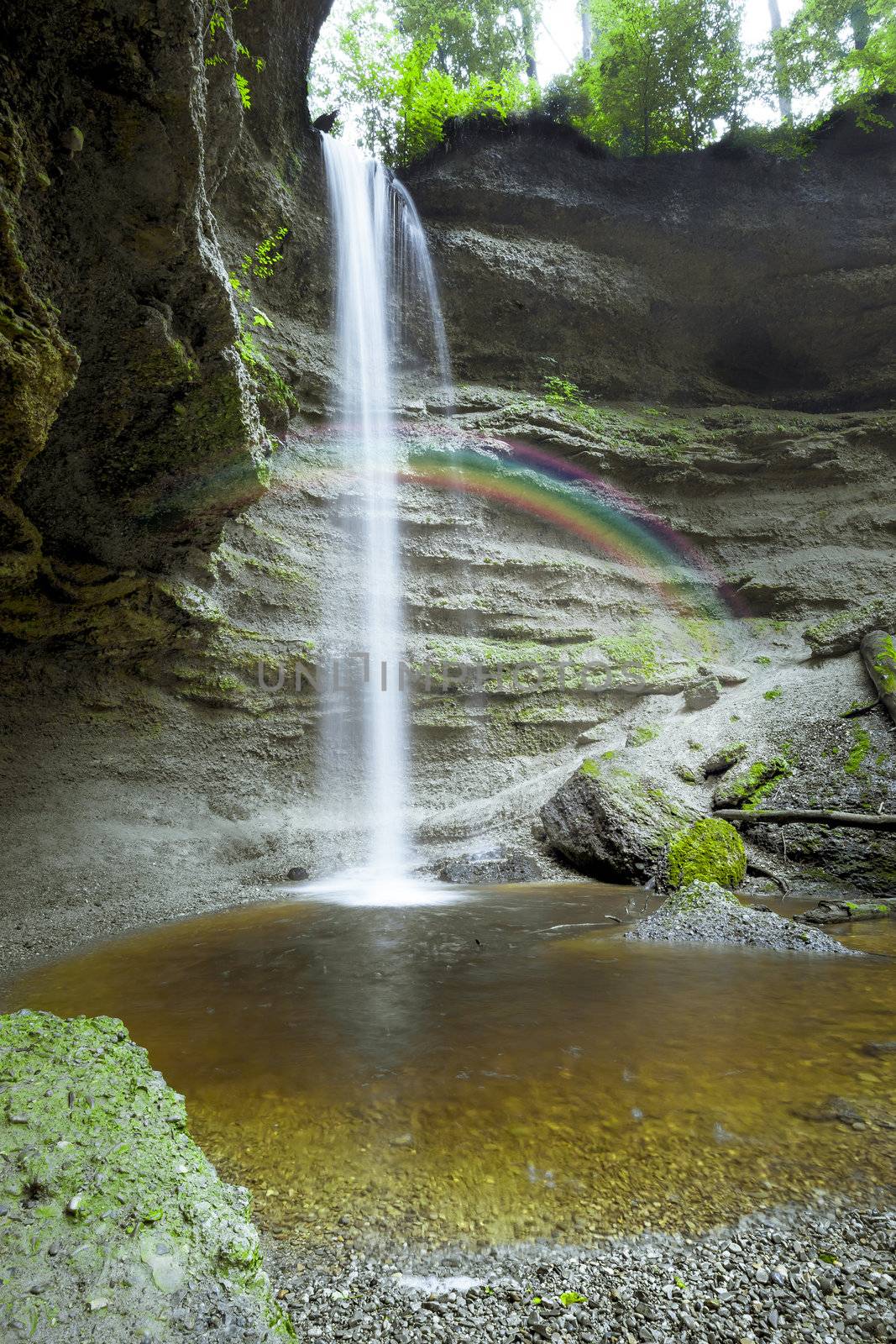 An image of a nice waterfall with rainbow at the Paehler Schlucht in Bavaria Germany