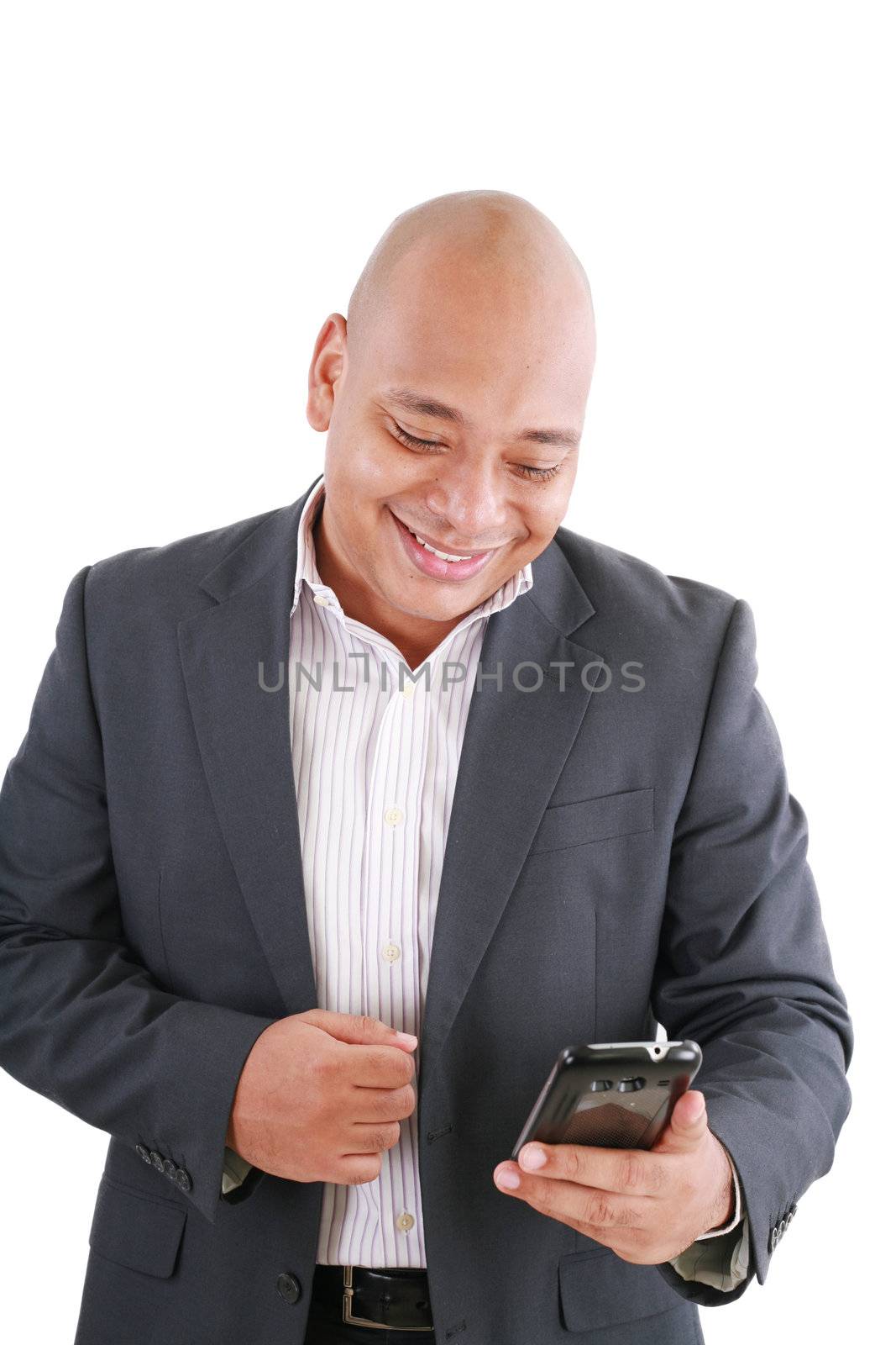 Portrait of an African American businessman text messaging by dacasdo