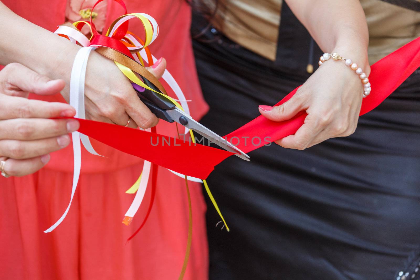 Grand opening. scissors cut the red ribbon. close-up
