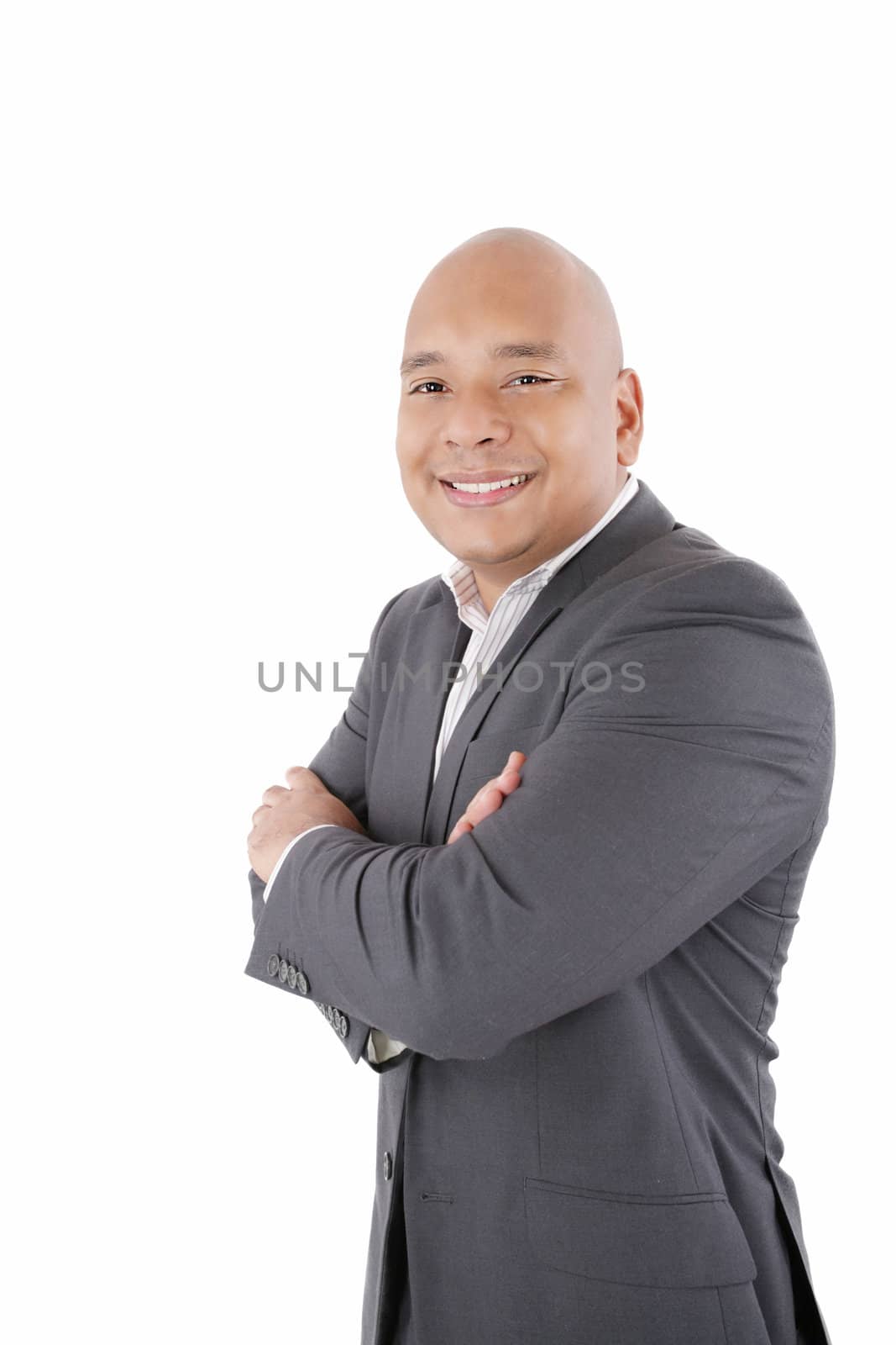Friendly and smiling businessman looking at camera with reliabil by dacasdo