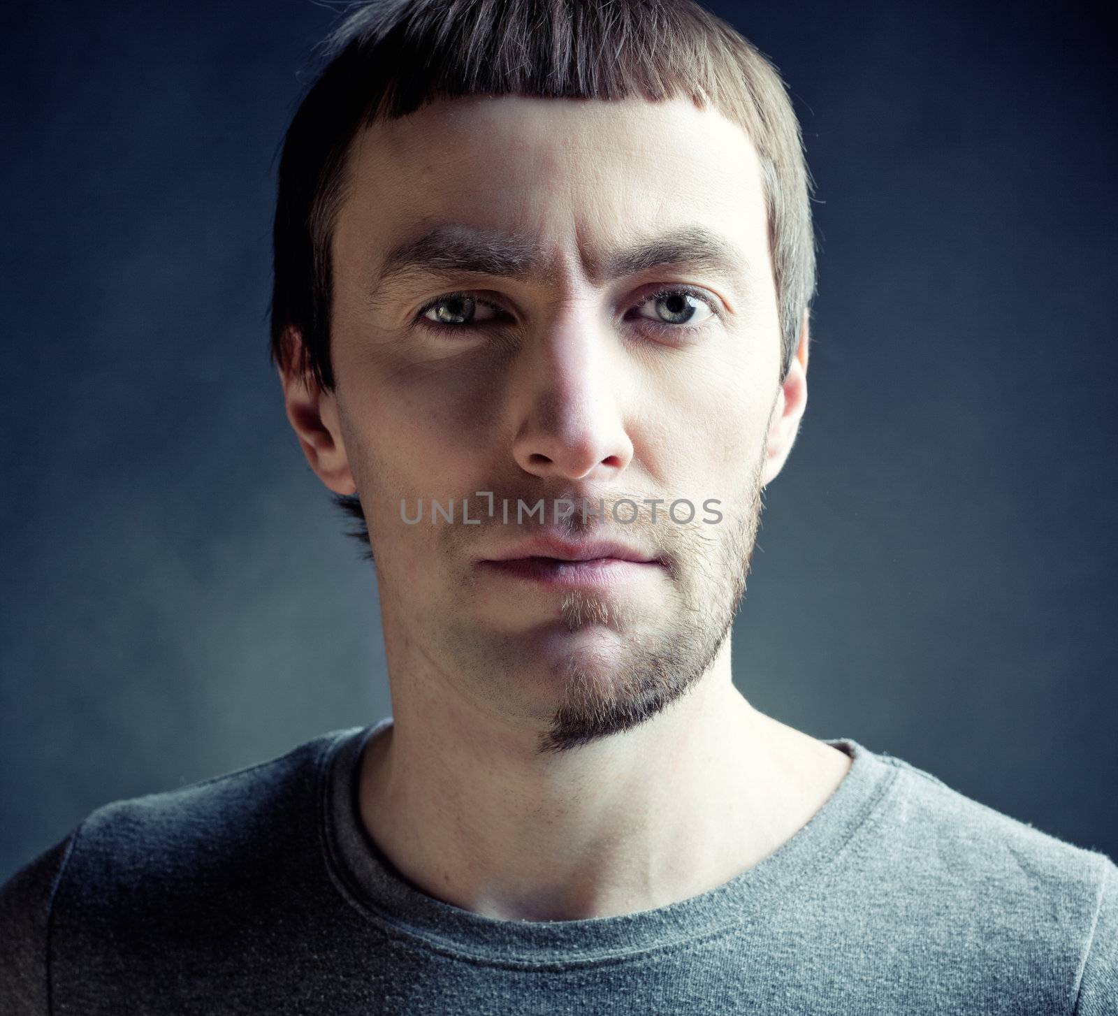 man with funny hair style studio photo