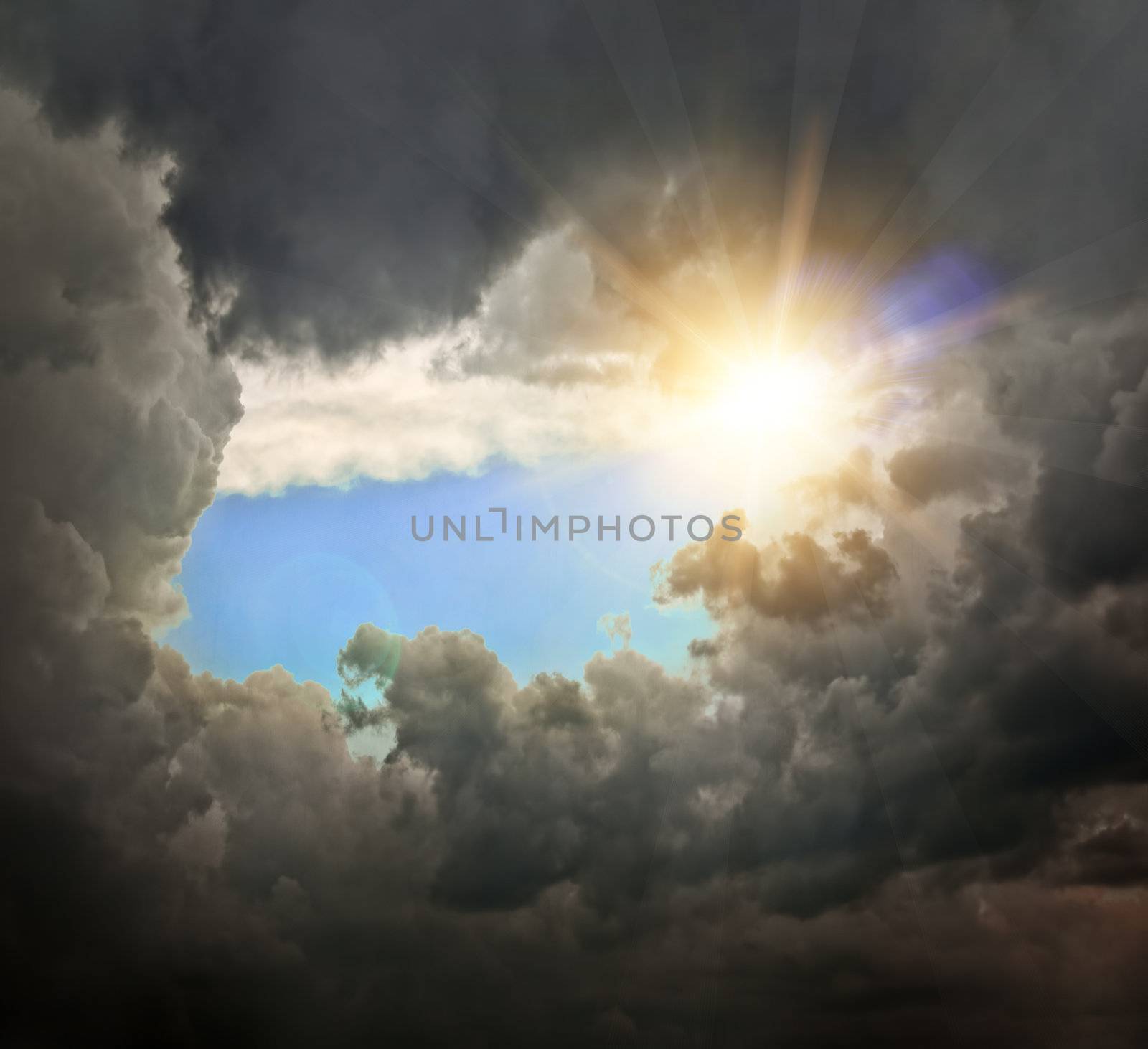 dramatic backdrop of the blue sky with clouds  and sun