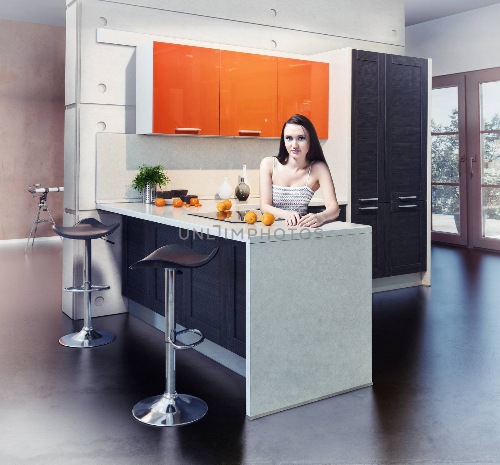 Young beautiful woman in kitchen interior photo