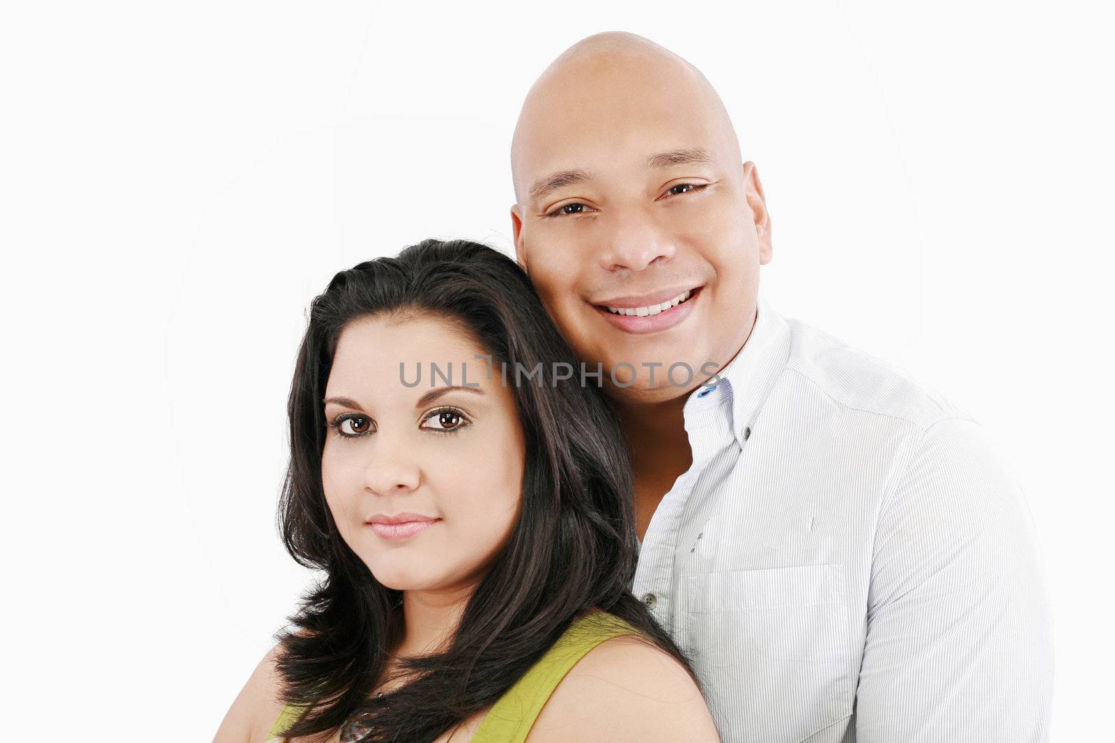 Closeup portrait of a sweet happy young couple smiling together. Isolated on white background
